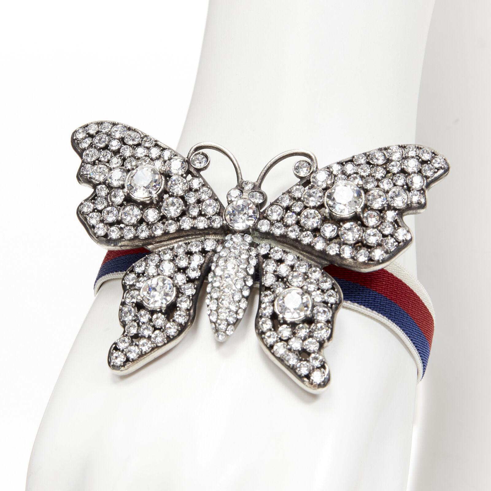GUCCI ALESSANDRO MICHELE antique silver crystal Butterfly web strap bracelet
Reference: TGAS/C01500
Brand: Gucci
Designer: Alessandro Michele
Model: 504656 I3N78 8518
Material: Metal, Fabric
Color: Silver
Pattern: Solid
Closure: Stretchy
Extra
