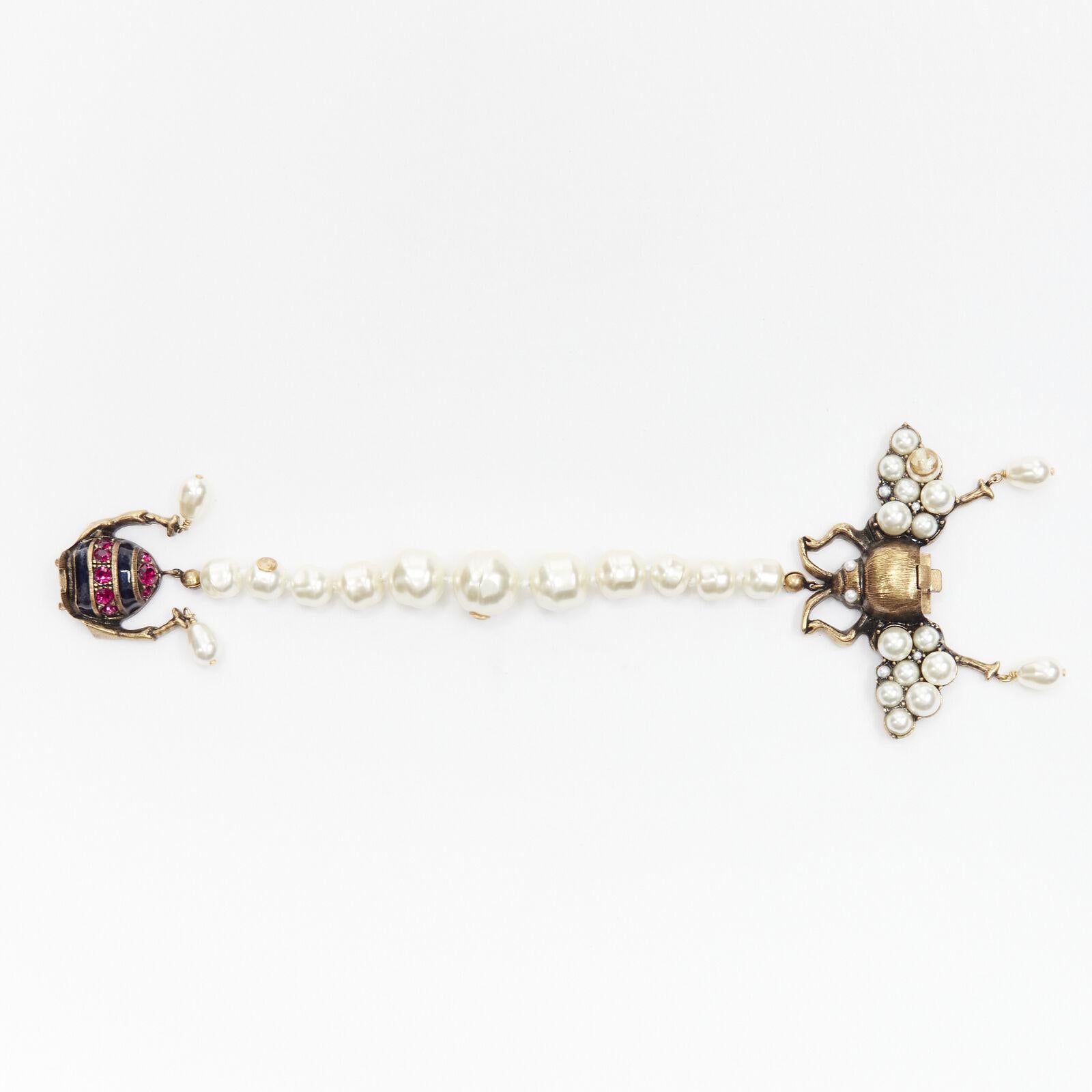 GUCCI ALESSANDRO MICHELE gold crystal enamel Bee faux pearl GG logo bracelet
Reference: TGAS/C01501
Brand: Gucci
Designer: Alessandro Michele
Material: Metal, Faux Pearl
Color: White, Multicolour
Pattern: Solid
Closure: Push Clasp
Extra Details: