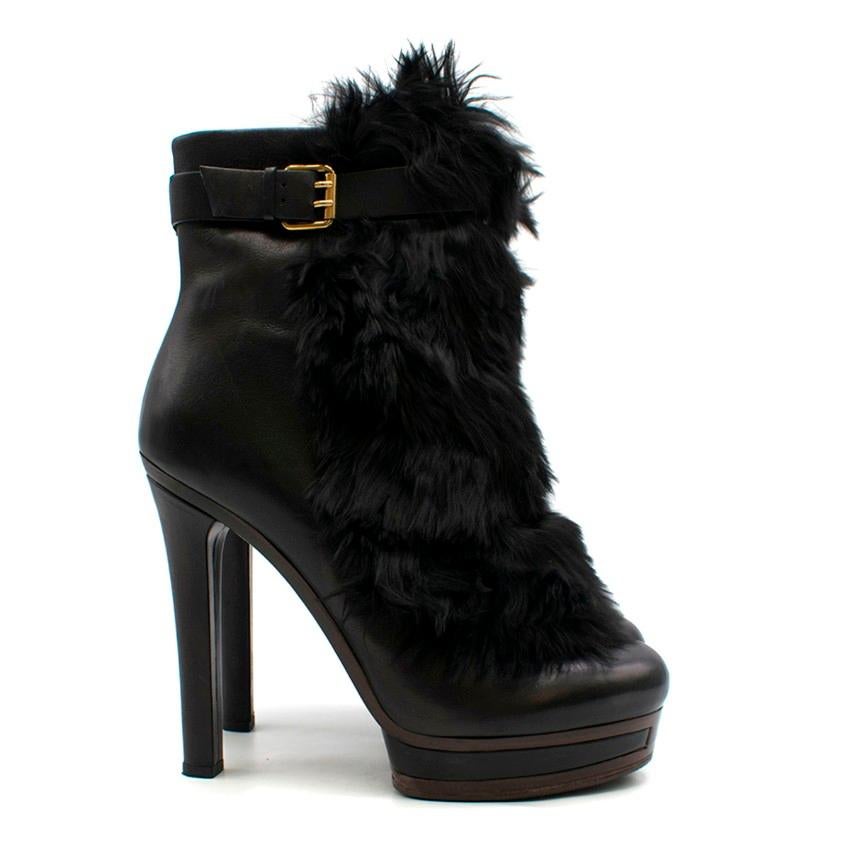 Gucci Alyona fur-panel platform ankle boots
 
 - Black, leather
 - Round toe, leather-covered high stiletto heel
 - Black alpaca fur front panel
 - Adjustable ankle strap
 - Inner side-zip fastening
 - Brown rubber sole
 - Comes with branded dust
