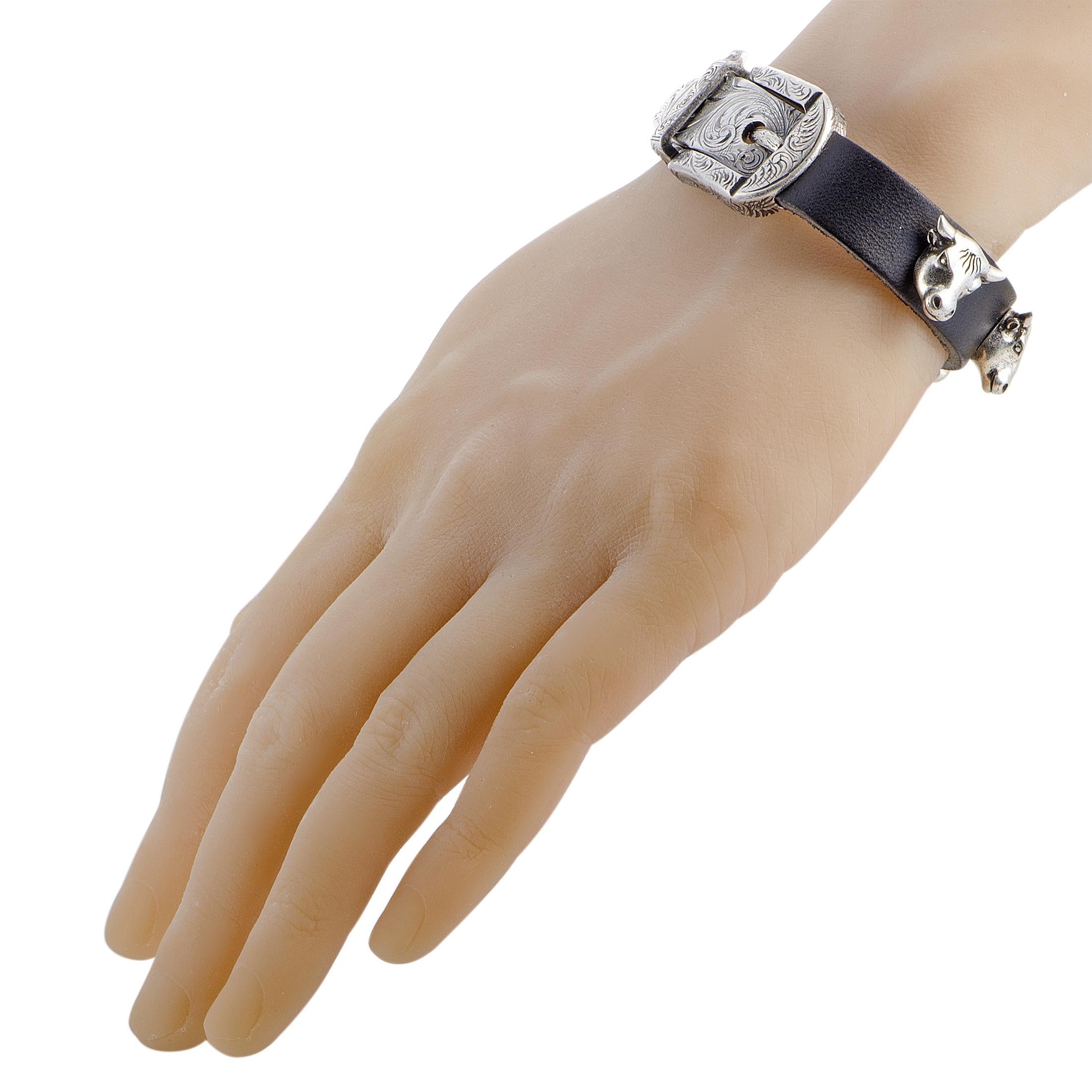 The Gucci “Anger Forest” bracelet is made out of aged sterling silver and black leather and weighs 71 grams. The bracelet measures 8” in length and 2.55” in diameter. 
 
 This item is offered in brand new condition and includes the manufacturer’s