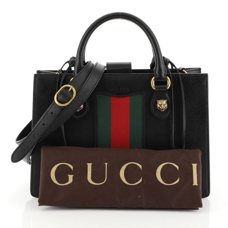 This Gucci Animalier Web Top Handle Tote Leather Medium, crafted from black leather, features dual rolled leather handles with whipstitched handles and animalier detailing, red and green web stripe on front, and aged gold-tone hardware. Its hidden