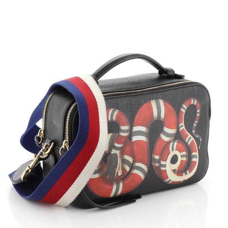 This Gucci Animalier Zip Camera Bag Printed Leather Medium, crafted in black printed leather, features leather top handle and gold-tone hardware. Its zip closure opens to a neutral fabric interior. 

Estimated Retail Price: $1,850
Condition: Good.