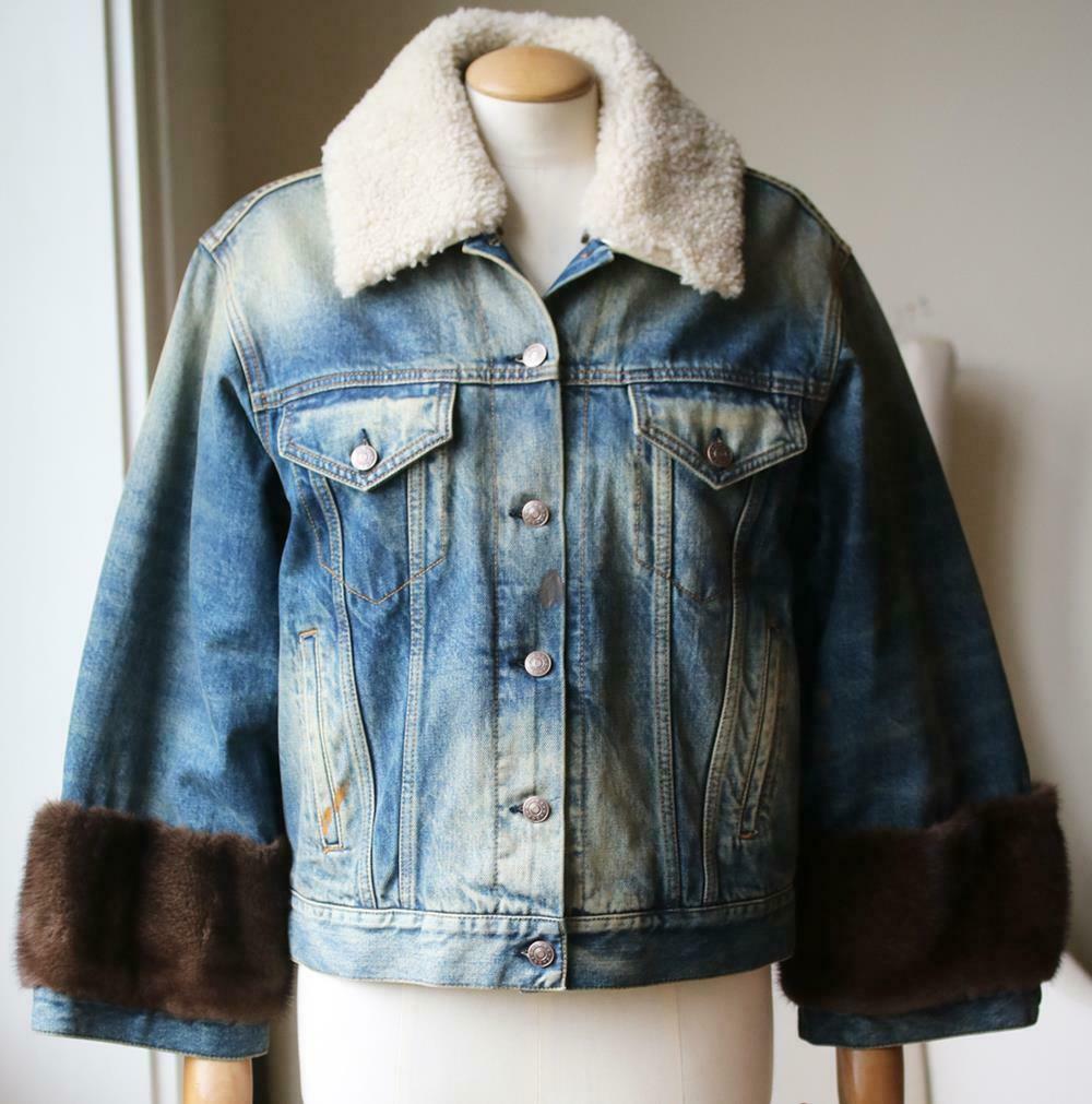 This denim jacket has a patch at the back, with the label's jaguar motif. This lightly faded style has been cut for an oversized fit. Blue denim, cream shearling and brown mink-fur. Button fastenings at the front. 100% cotton; trim1: 100% mink fur;