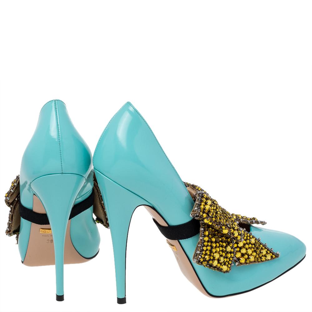 It's a simple pair of aqua blue pumps that Gucci elevates by adding a removable crystal-embellished bow detail. So, it's like two shoes for the price of one! The Elaisa pumps are made of leather and elevated on 12.5 cm heels.

