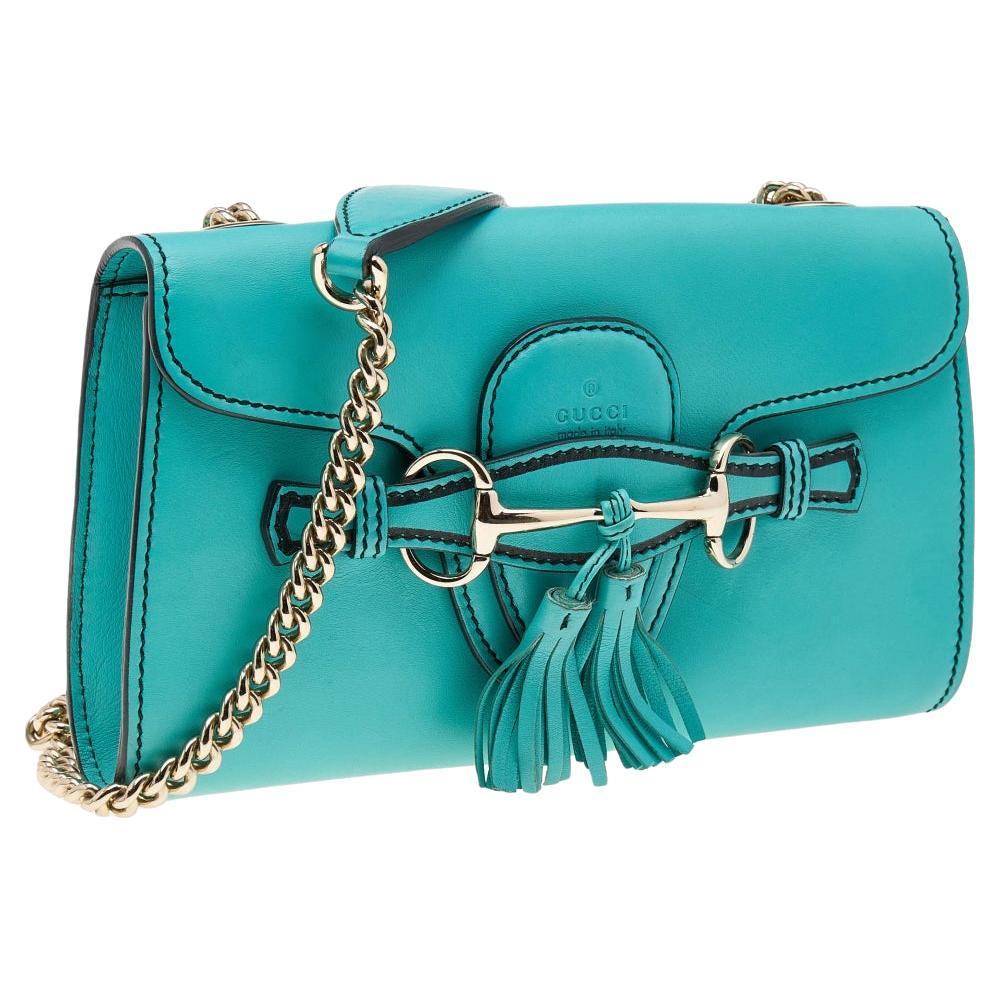 Gucci's handbags are not only well-crafted but are also coveted because of their high appeal. This Emily Chain shoulder bag, like all of Gucci's creations, is fabulous and popular. It has been crafted from leather and styled with a flap that leads