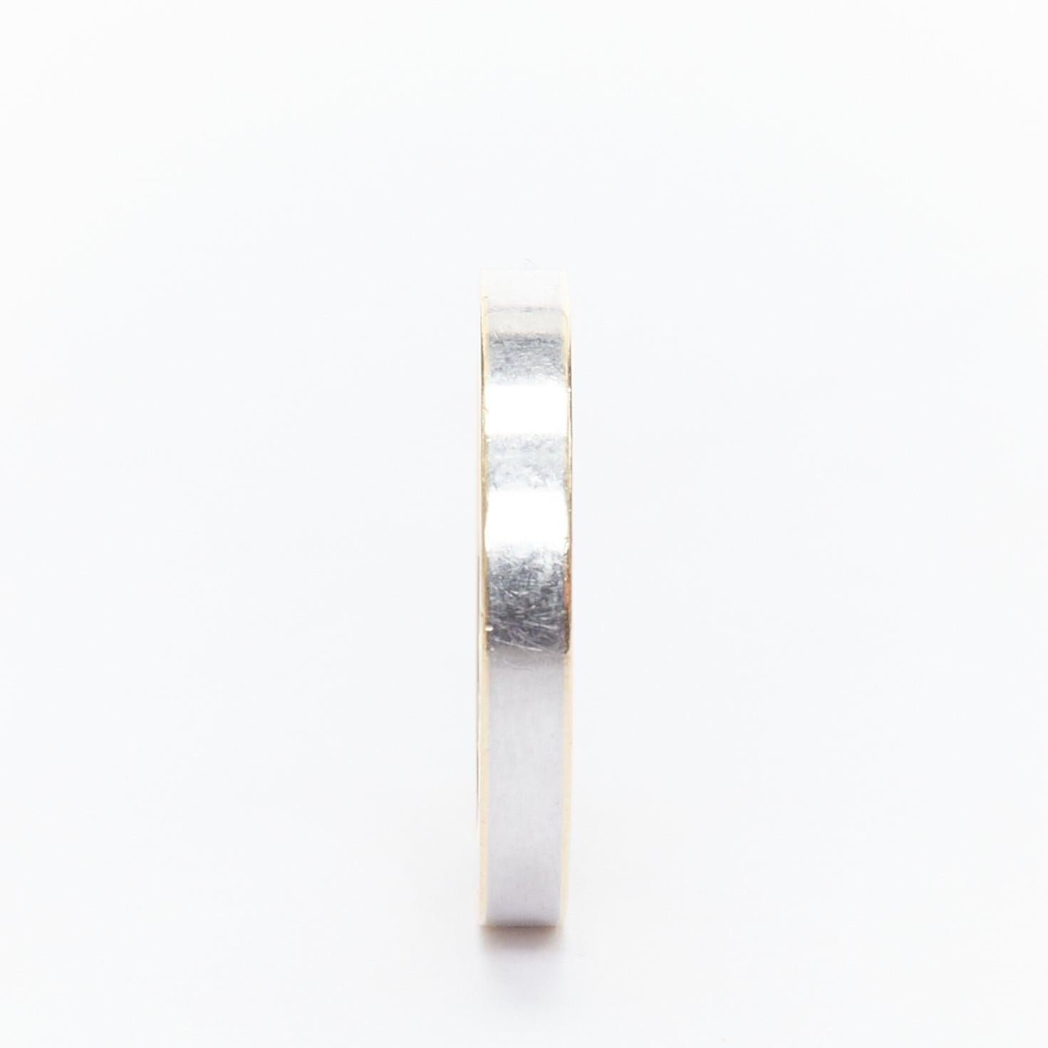 GUCCI AU 760 gold silver tone GG monogram engraved ring
Reference: ALCU/A00049
Brand: Gucci
Material: Steel, Yellow Gold
Color: Gold, Silver
Pattern: Monogram
Made in: Italy

CONDITION:
Condition: Very good, this item was pre-owned and is in very