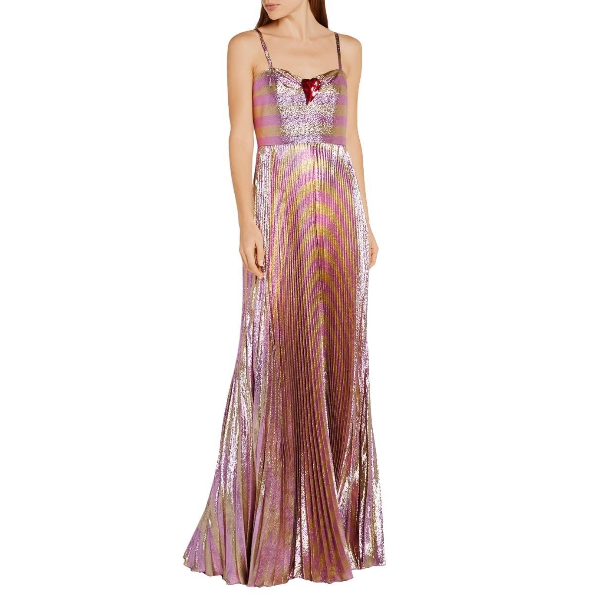 Made from striped lamé with a touch of silk, this gown is embellished with a red sequined heart and finished with a pleated skirt that creates beautiful movement.
Pink and gold lamé
Sleeveless with spaghetti straps and a gathered sweetheart
