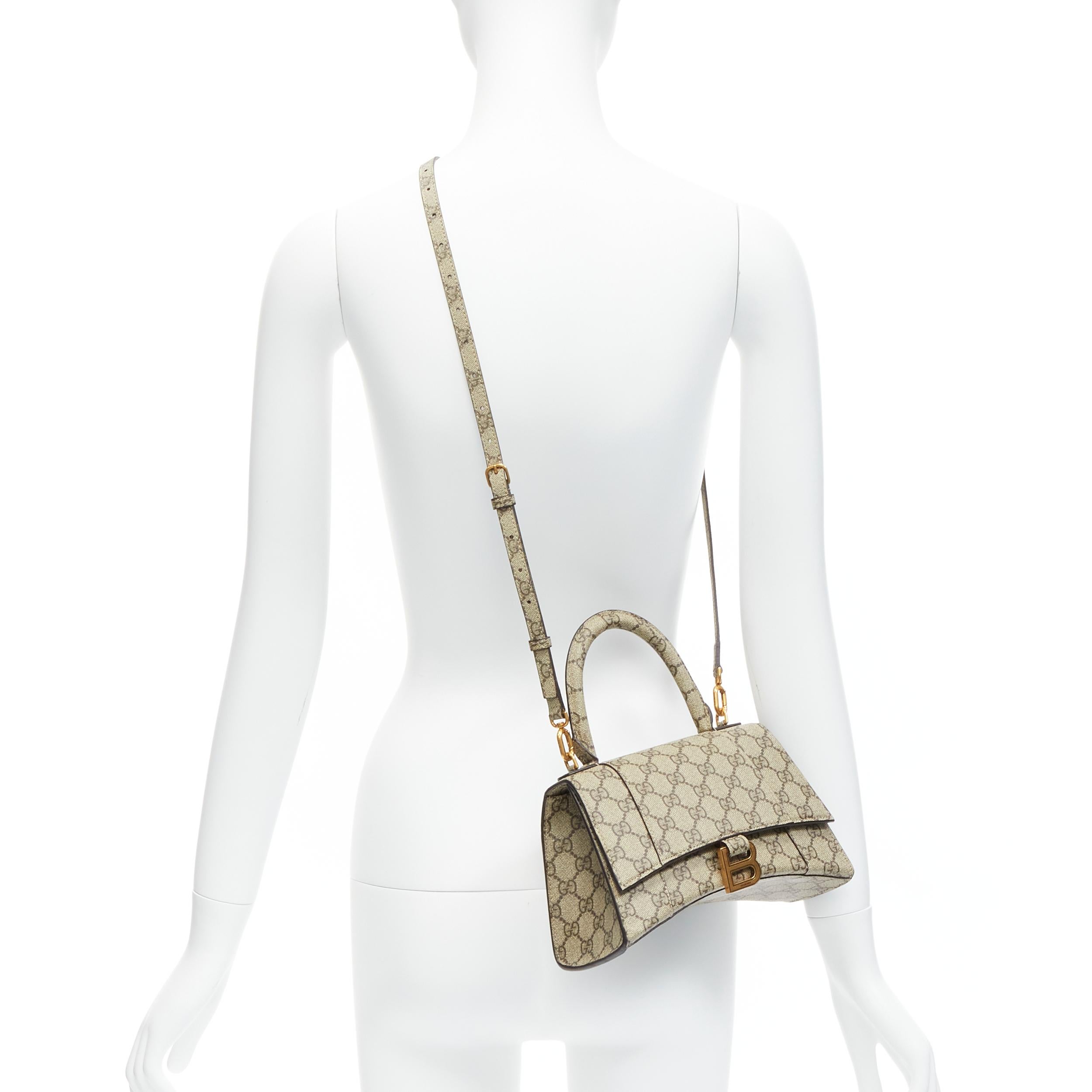 GUCCI BALENCIAGA Hourglass Hacker Project Runway GG B buckle crossbody bag
Reference: LNKO/A02133
Brand: Gucci
Designer: Alessandro Michele
Model: Hourglass
Collection: Balenciaga Hacker Project - Runway
Material: Canvas, Metal
Color: Brown
Pattern: