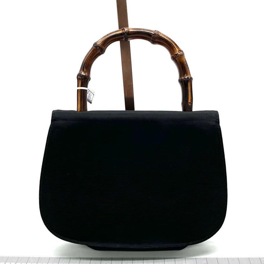 Gucci Bamboo 1947 Night Super Mini Black Nylon Evening Bag with Original Chain
 These are professional photos of the actual bag.
 This Gucci crossbody bag has the signature oval design with the bamboo turn lock.
 CONDITION: EXCELLENT
 Light rubbing