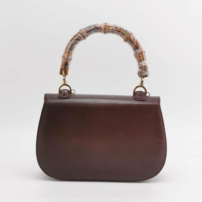 Gucci Bamboo 1947 Top Handle Bag Box Leather Medium Dark Chocolate Brown
 These are professional photos of the actual bag offered
 This Gucci crossbody bag has the signature oval design with the bamboo turn lock.
 CONDITION: VERY GOOD
 Light rubbing