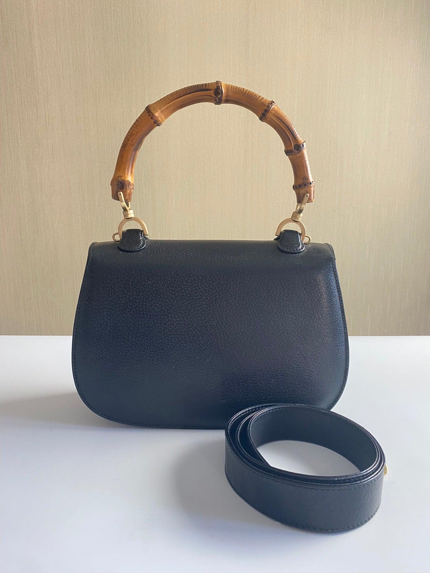 Gucci Bamboo 1947 Top Handle Bag Leather Medium Black
 These are professional photos of the actual bag offered by Luxbags.
 This Gucci crossbody bag has the signature oval design with the bamboo turn lock.
 CONDITION: EXCELLENT
 Light rubbing around