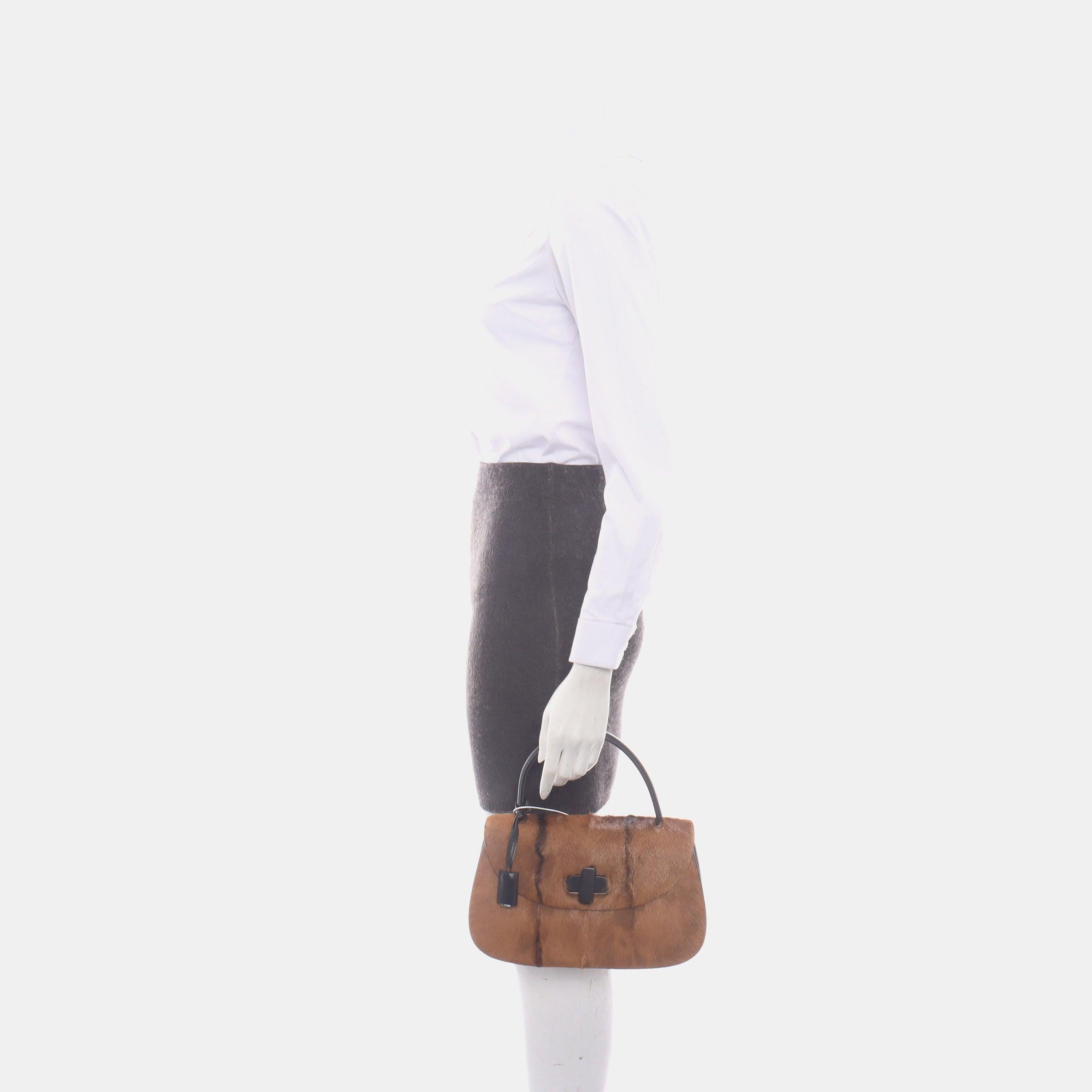 Gucci Bamboo 1947 Top Handle Bag Leather Medium Brown Pony-style Calfskin Leather
 These are professional photos of the actual bag offered by Luxbags.
 This Gucci crossbody bag has the signature oval design with the bamboo turn lock.
 CONDITION: