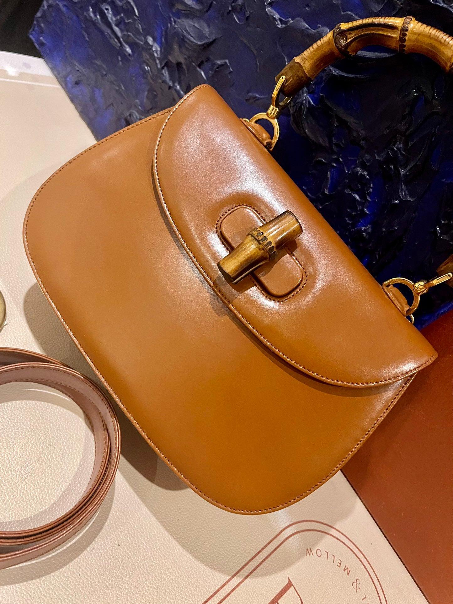 Gucci Bamboo 1947 Top Handle Bag Leather Medium Tan Brown
 These are professional photos of the actual bag offered by Luxbags.
 This Gucci crossbody bag has the signature oval design with the bamboo turn lock.
 CONDITION: EXCELLENT
 Light rubbing