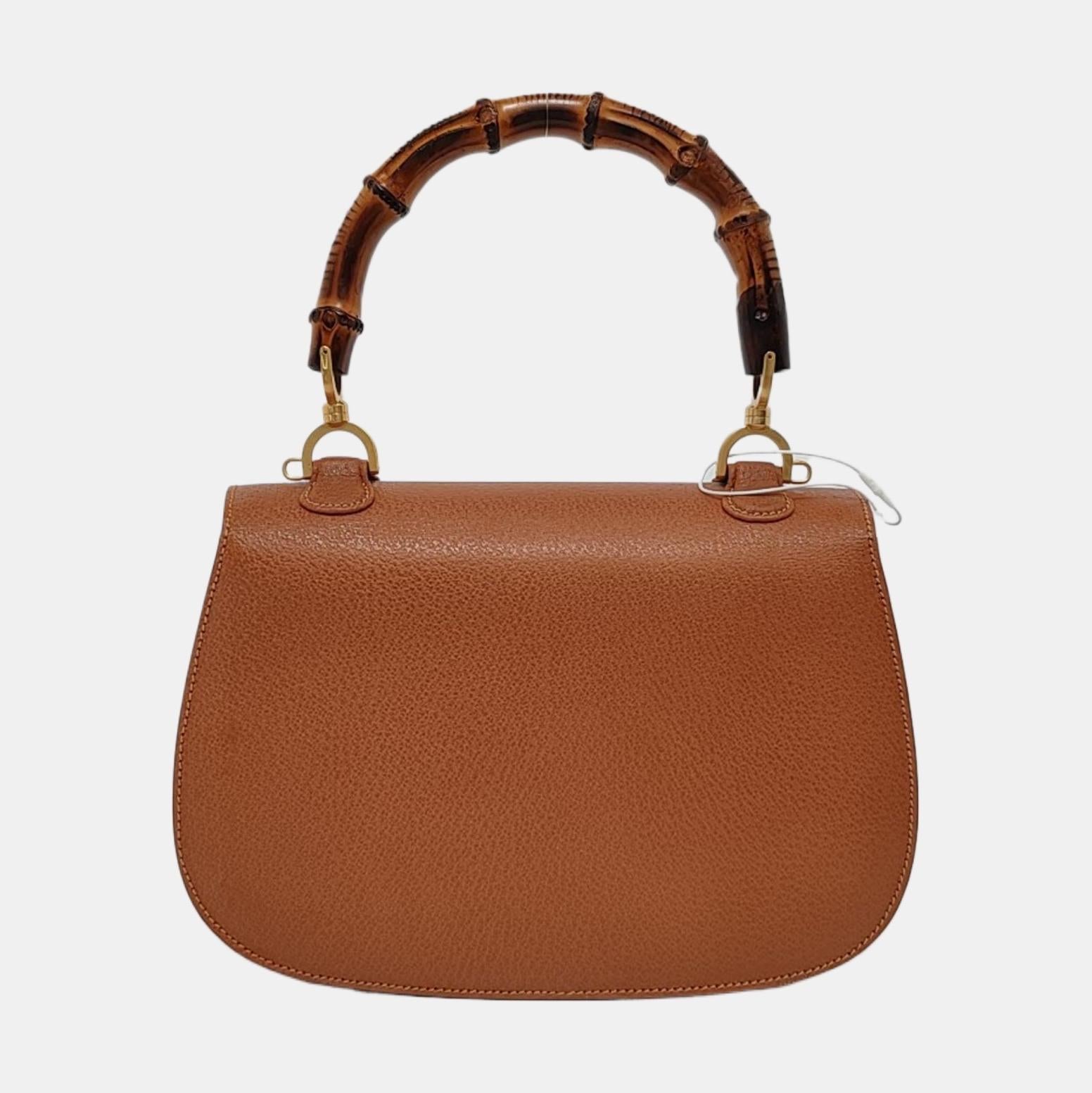 Gucci Bamboo 1947 Top Handle Bag Leather Medium Tan Brown
 These are professional photos of the actual bag offered by Luxbags.
 This Gucci crossbody bag has the signature oval design with the bamboo turn lock.
 CONDITION: EXCELLENT

Light rubbing