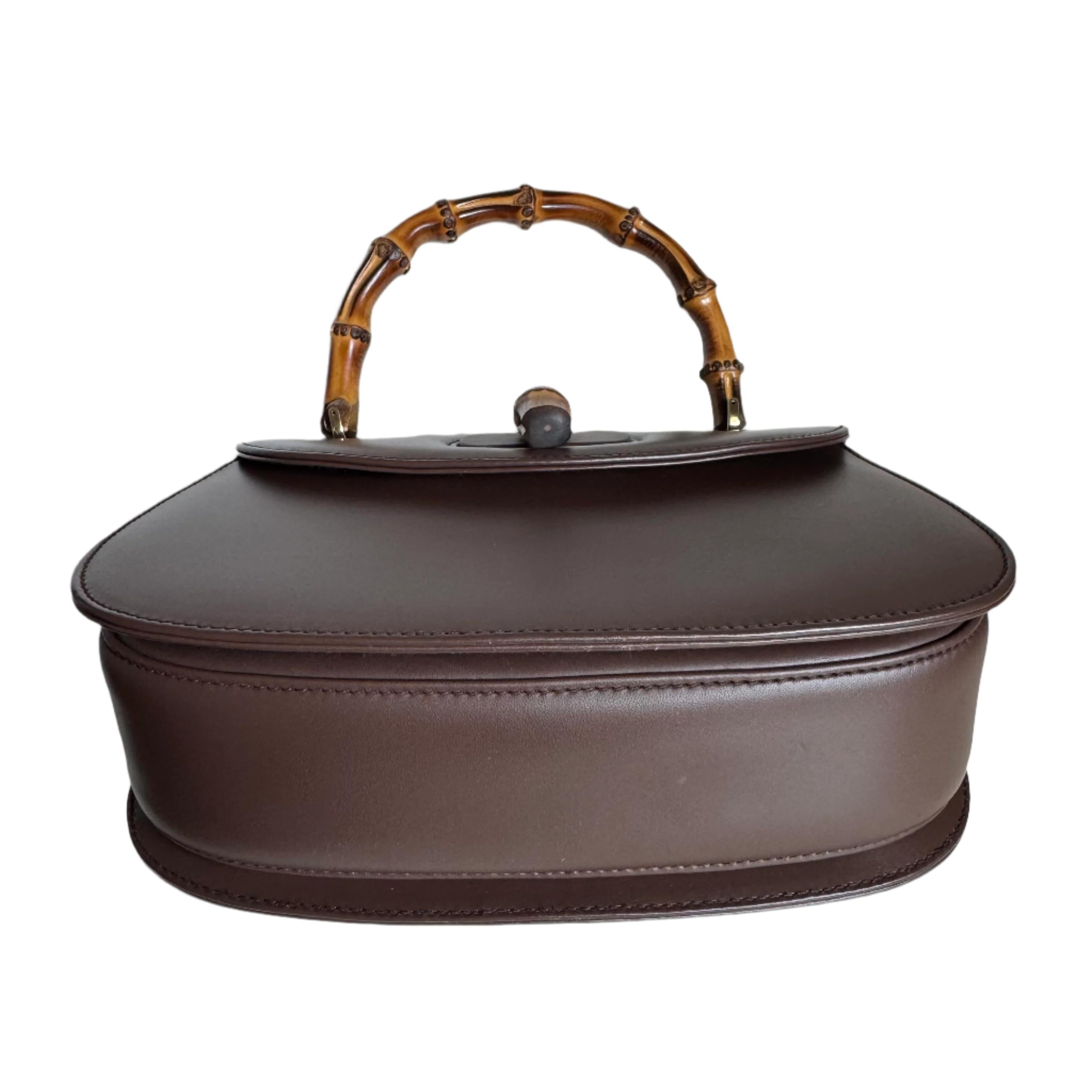 Gucci Bamboo 1947 Top Handle Bag Leather Small Dark chocolate brown 

 These are professional photos of the actual bag offered
 This Gucci crossbody bag has the signature oval design with the bamboo turn lock.
 CONDITION: Mint
 DETAILS 
 
 GUCCI 
