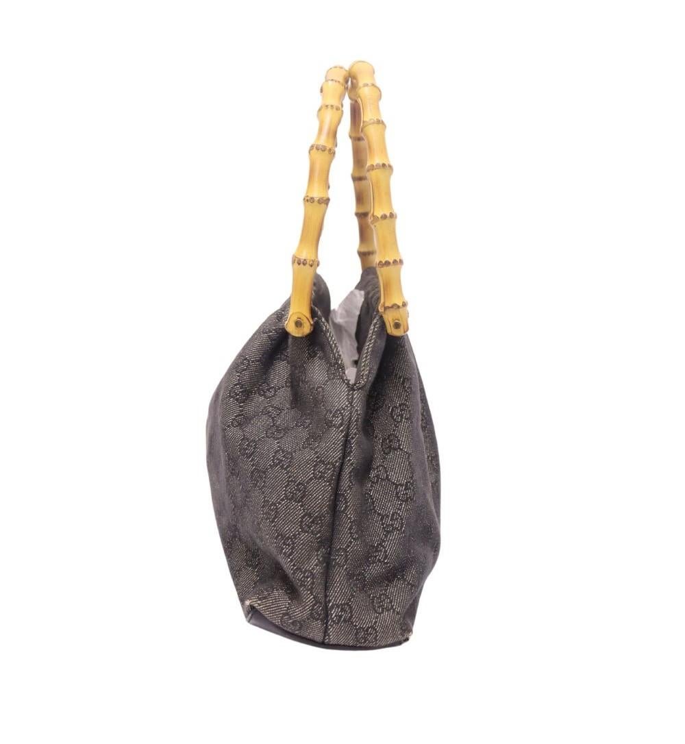 Gucci Bamboo Denim Bag, Features bamboo handles, GG canvas, leather bottom, fabric lined interior and one interior pocket.

Material: Leather
Hardware: Gold
Height: 24cm
Width: 33cm
Depth: 10cm
Handle Drop: 17cm
Overall condition: Good
Interior