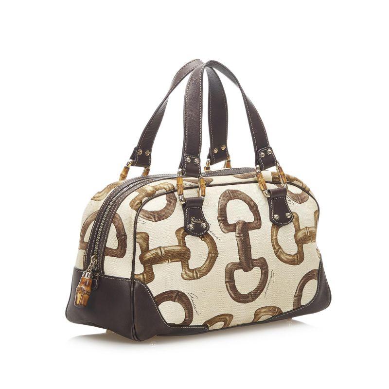Gucci Bamboo horsebit canvas

Very good condition, show some light signs of use and wear but nothing visible.
Printed canvas bag with bamboo finishes, small handstrap and 1 zipper pocket in the inside.
Monogram canvas bag with leather handstrap and