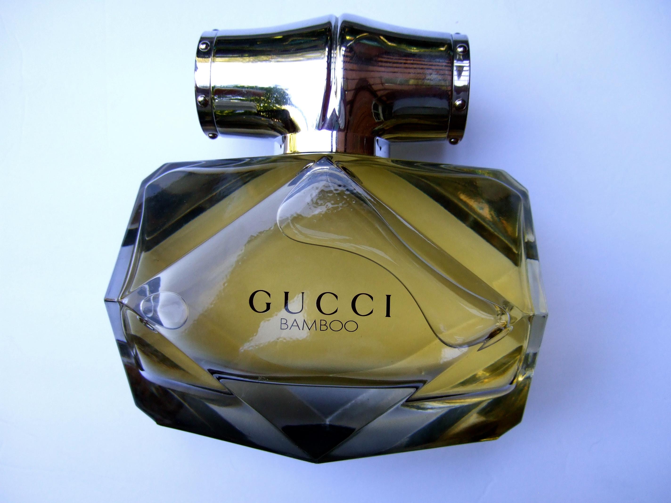 Gucci Bamboo huge scale glass factice decorative display bottle c 21st c 
The large faceted glass bottle is a replica of Gucci's bamboo fragrance 
The dummy display bottle is filled with colored water is similar to the 
designer fragrance promotion