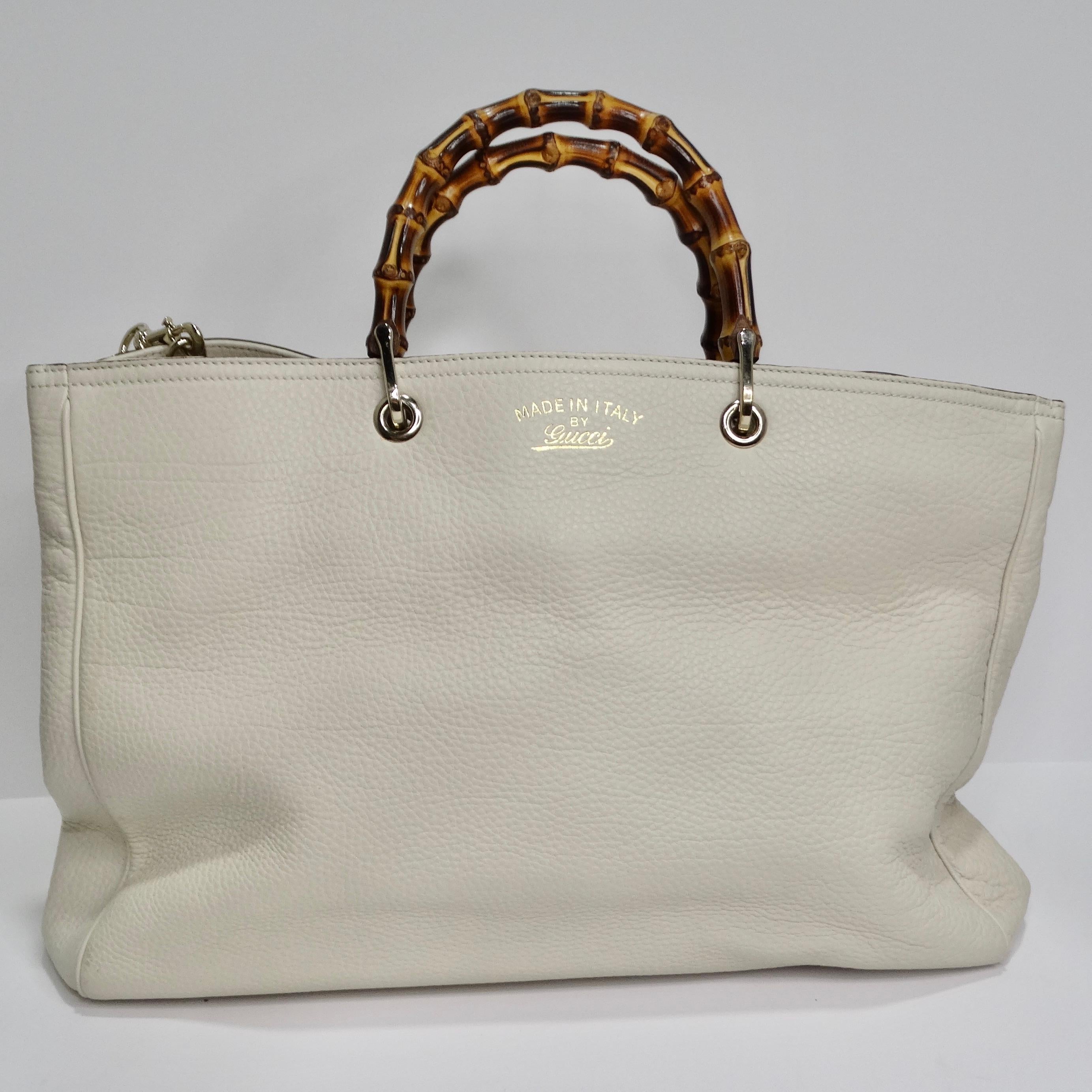 Elevate your style with the iconic Gucci Bamboo Shopper Leather Tote Bag—a true embodiment of luxury, sophistication, and timeless elegance. Crafted with meticulous attention to detail, this large ivory leather tote is a symbol of Gucci's renowned