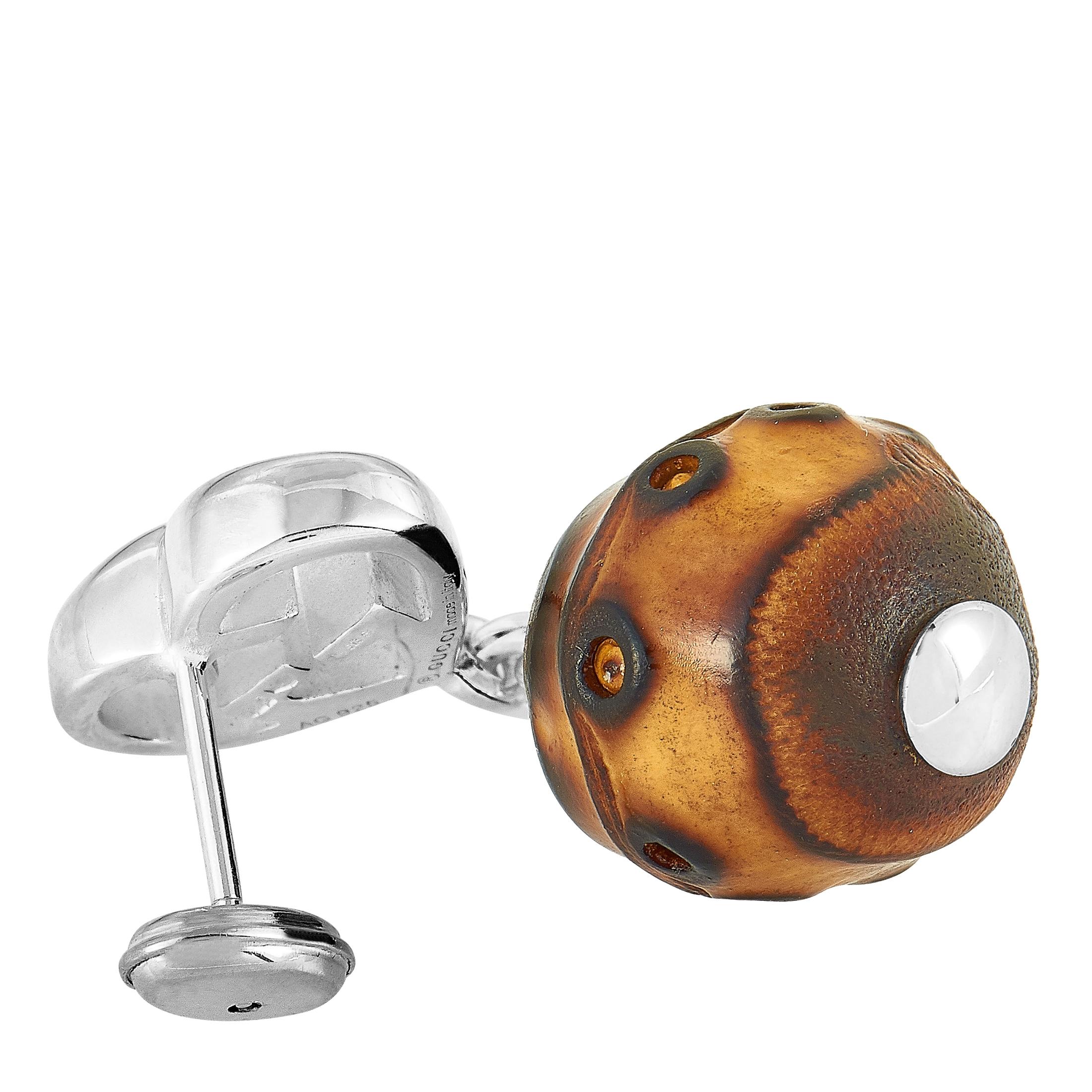 The Gucci “Bamboo” earrings are made out of silver and bamboo wood. The earrings measure 1.30” in length and 0.50” in width and each of the two weighs 4.7 grams.
 
 This pair of earrings is offered in brand new condition and includes the