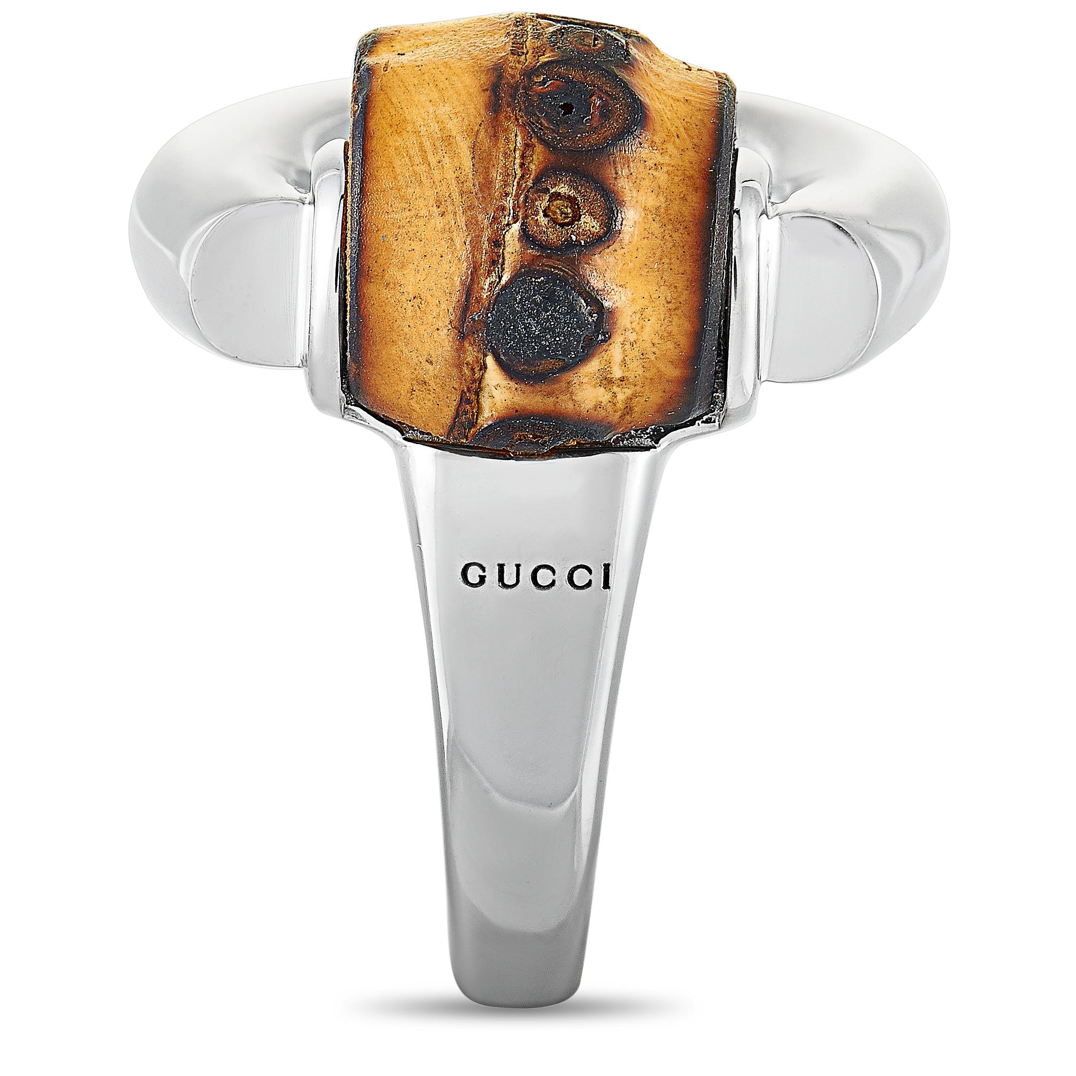 The Gucci “Bamboo” ring is made out of silver and natural bamboo and weighs 18.5 grams. The ring boasts band thickness of 3 mm and top height of 10 mm, while top dimensions measure 23 by 22 mm.
 
 This item is offered in brand new condition and