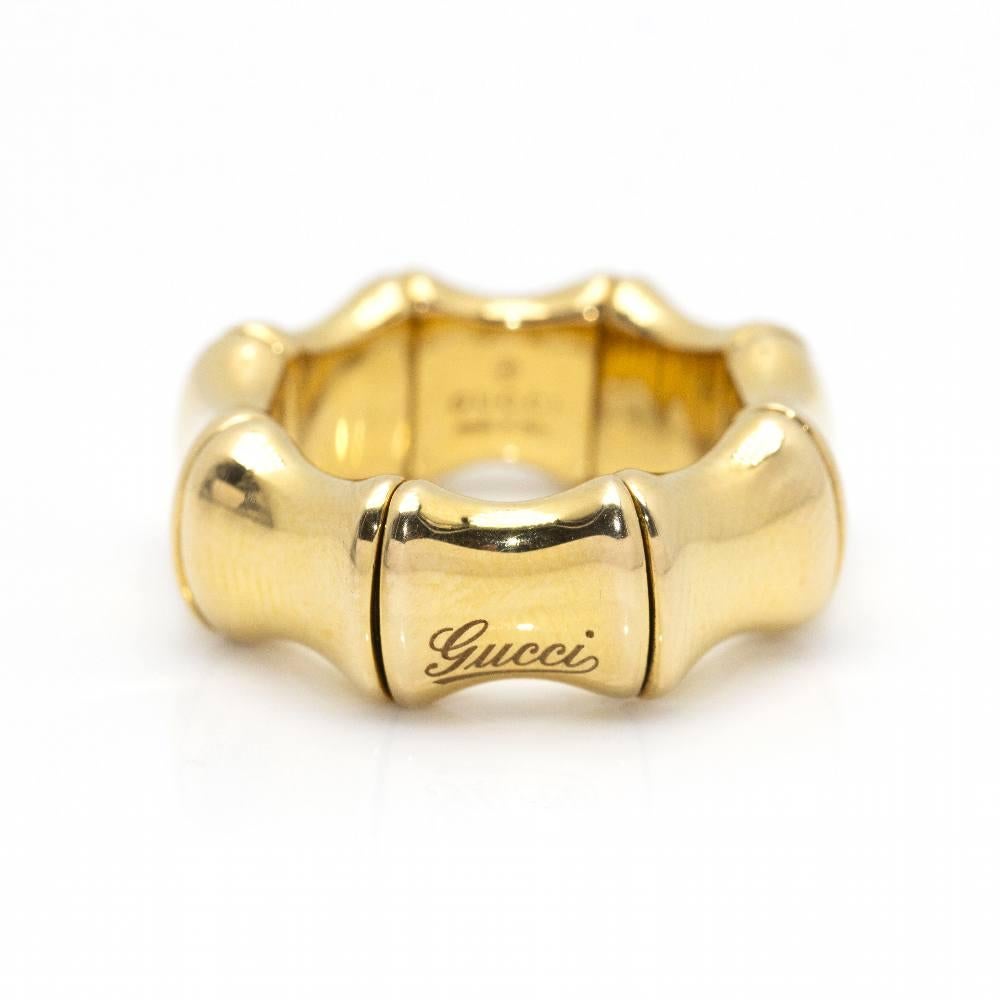 Italian design GUCCI ring, BAMBOO SPRING collection in Yellow Gold for woman, adorned with the distinctive name emblem of the Firm  This ring is flexible so it adapts from size 11,5 to 19  18kt Yellow Gold  Measures: Width 9mm  8,49 grams  Brand new