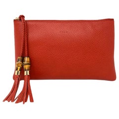 GUCCI: Bamboo Tassel Calf Clutch 