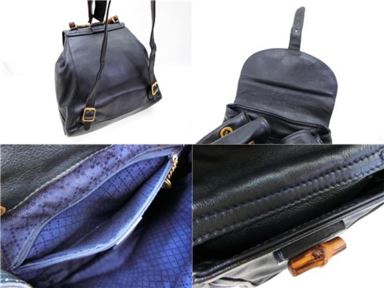 dark blue leather backpack