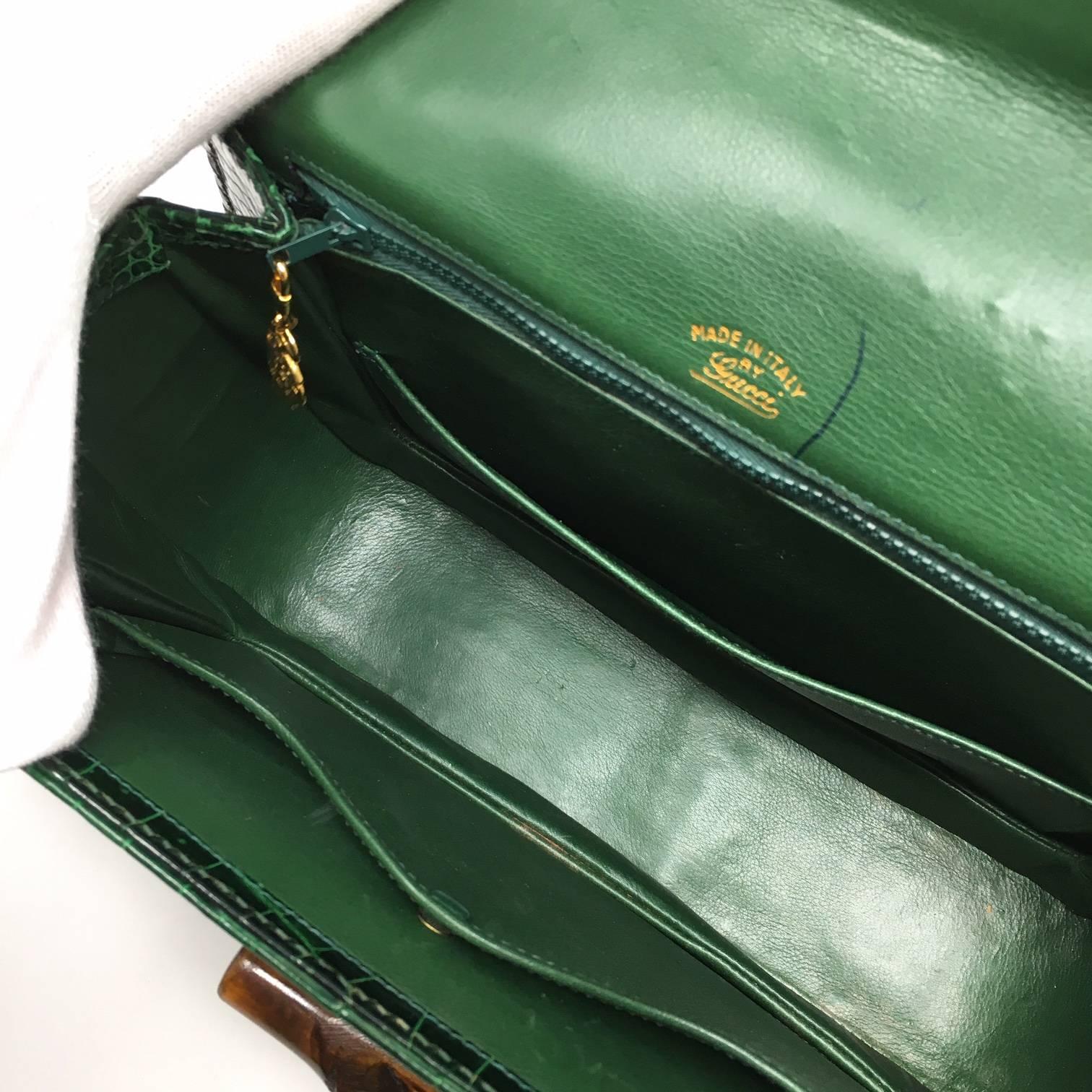Iconic and Rare Gucci Bamboo Vintage Bag in Green Crocodile Leather. The Bag has a Structure with a Bamboo Handle , Single Frontal Flap, Brass Hardware and a Bamboo turn Lock dettails . The Production of this Beautiful Piece Dates Back to about '