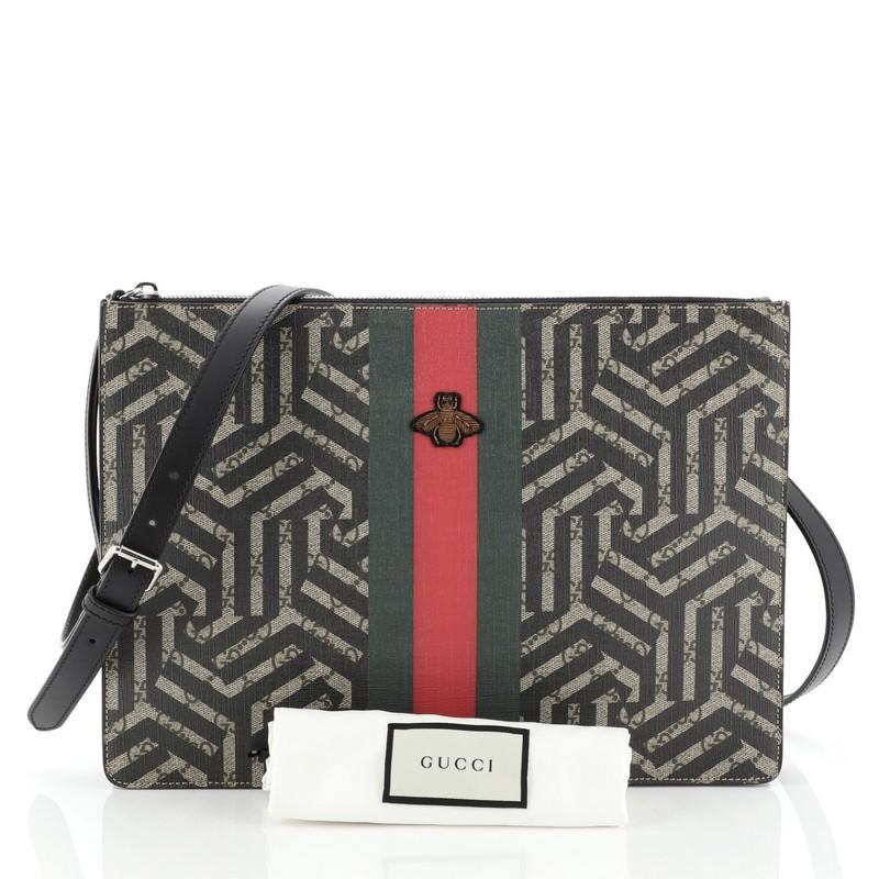 This Gucci Bee Web Zip Messenger Bag Caleido Print GG Coated Canvas Large, crafted in brown Caleido print GG coated canvas, features an adjustable strap, web with embroidered bee detail, front zip pocket and silver-tone hardware. Its top zip closure