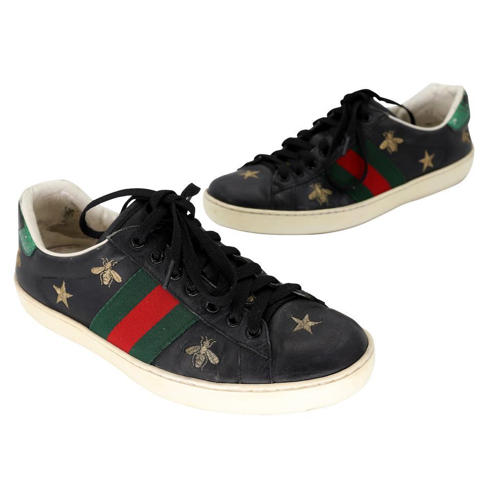 Since its debut, the Ace sneaker has become a mainstay of Gucci collections. The retro-looking design is inspired by a Gucci sneaker from the 1970s, with Web stripe along the sides. The low-top silhouette has been embellished with metallic gold