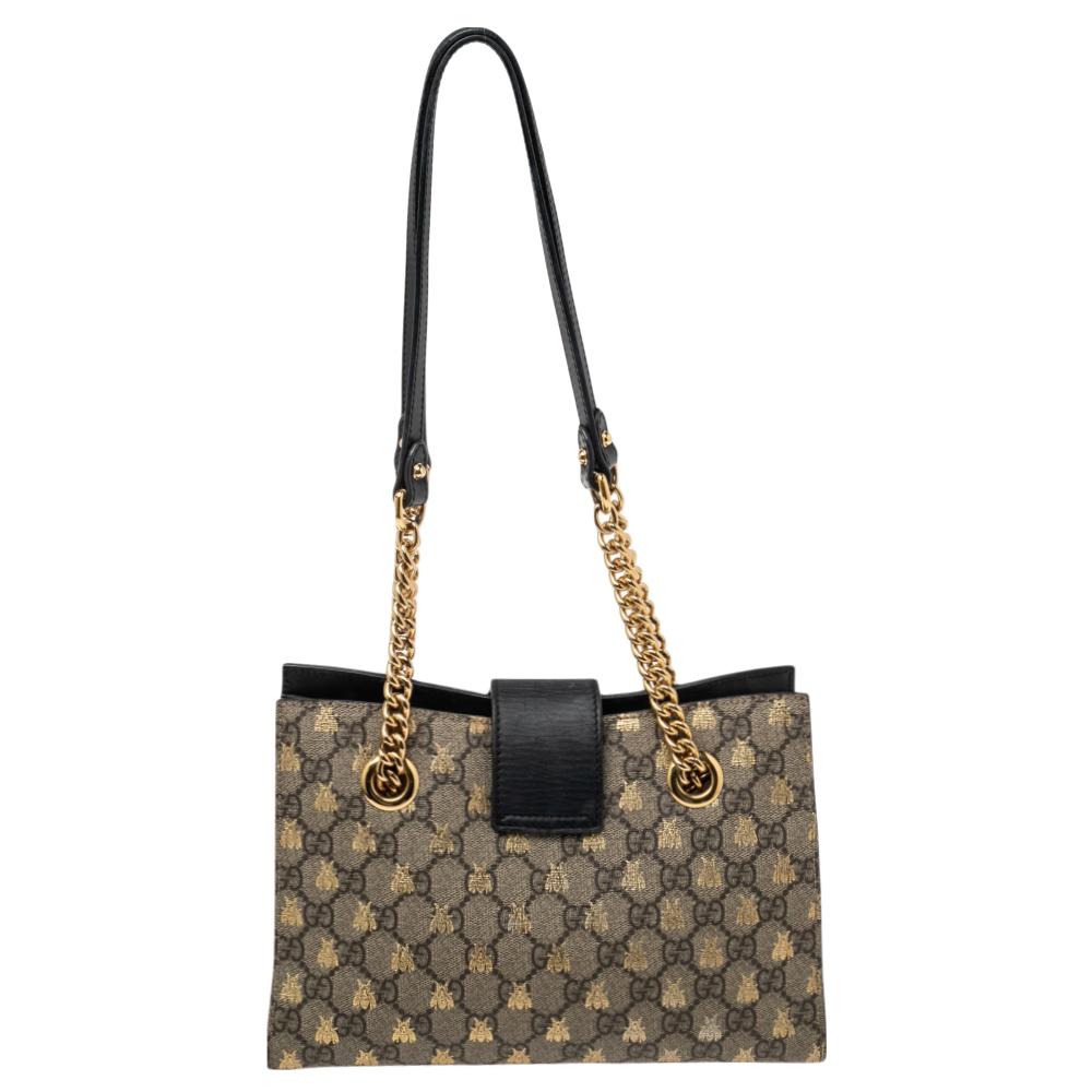 High in appeal, this tote from Gucci is sure to add sparks of luxury to your wardrobe! It is crafted from GG Supreme canvas as well as leather into a spacious silhouette. It is held by two hands, is lined with Alcantara, and detailed with a