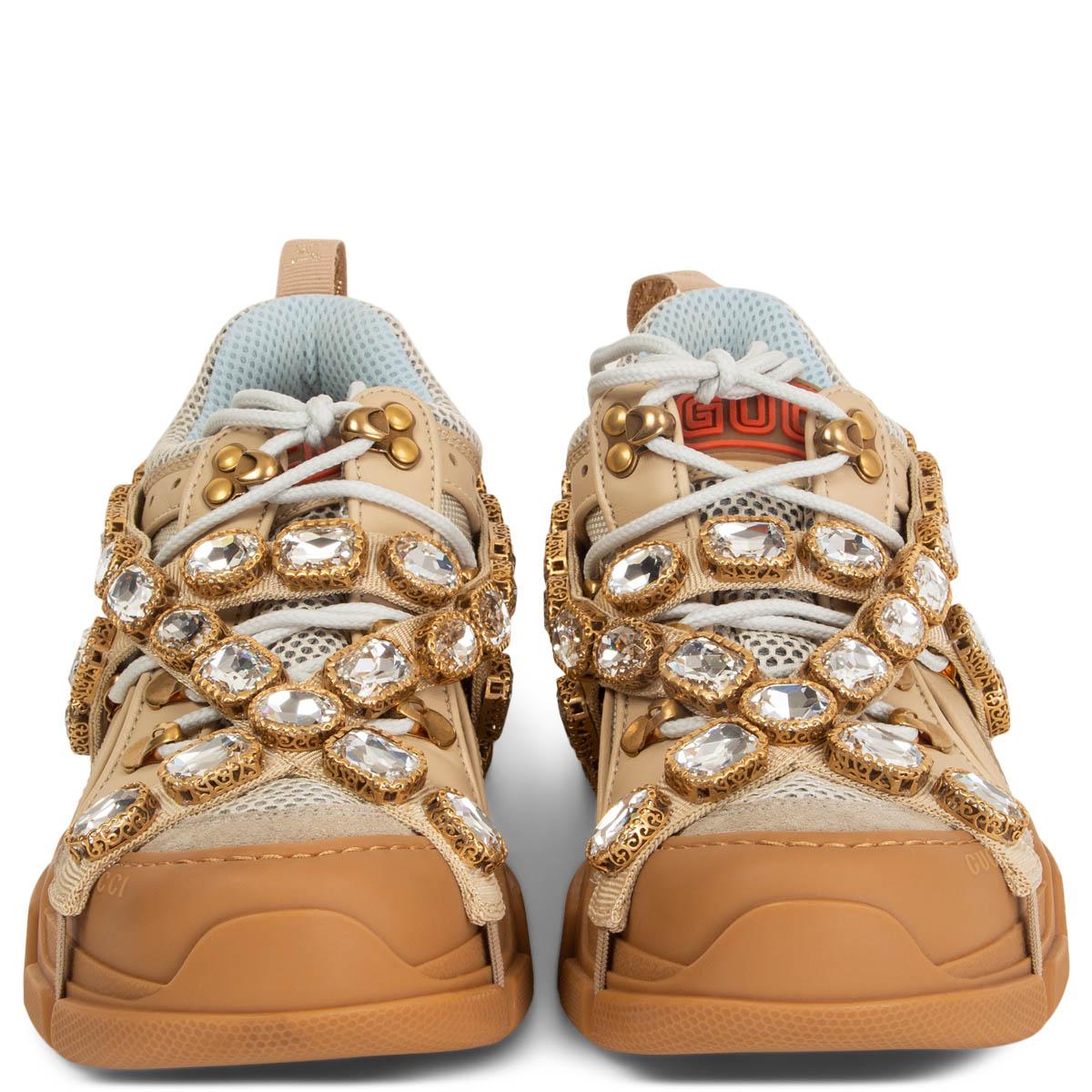 100% authentic Gucci Flashtrek sneakers in beige leather, suede and technical fabric with rubber lug sole from the fall/winter 2018 collection runway. Sparkling crystals are embroidered onto a removable elastic strap, wrapping around these sneakers.
