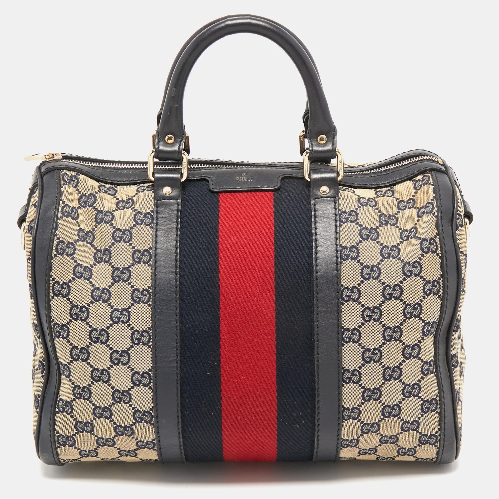 Imbued with signature elements, this Gucci bag is paired with timeless elegance and a contemporary shape. The gold-tone accents beautify the bag, and its canvas-lined interior will carry your daily essentials with ease. Crafted from the GG canvas,