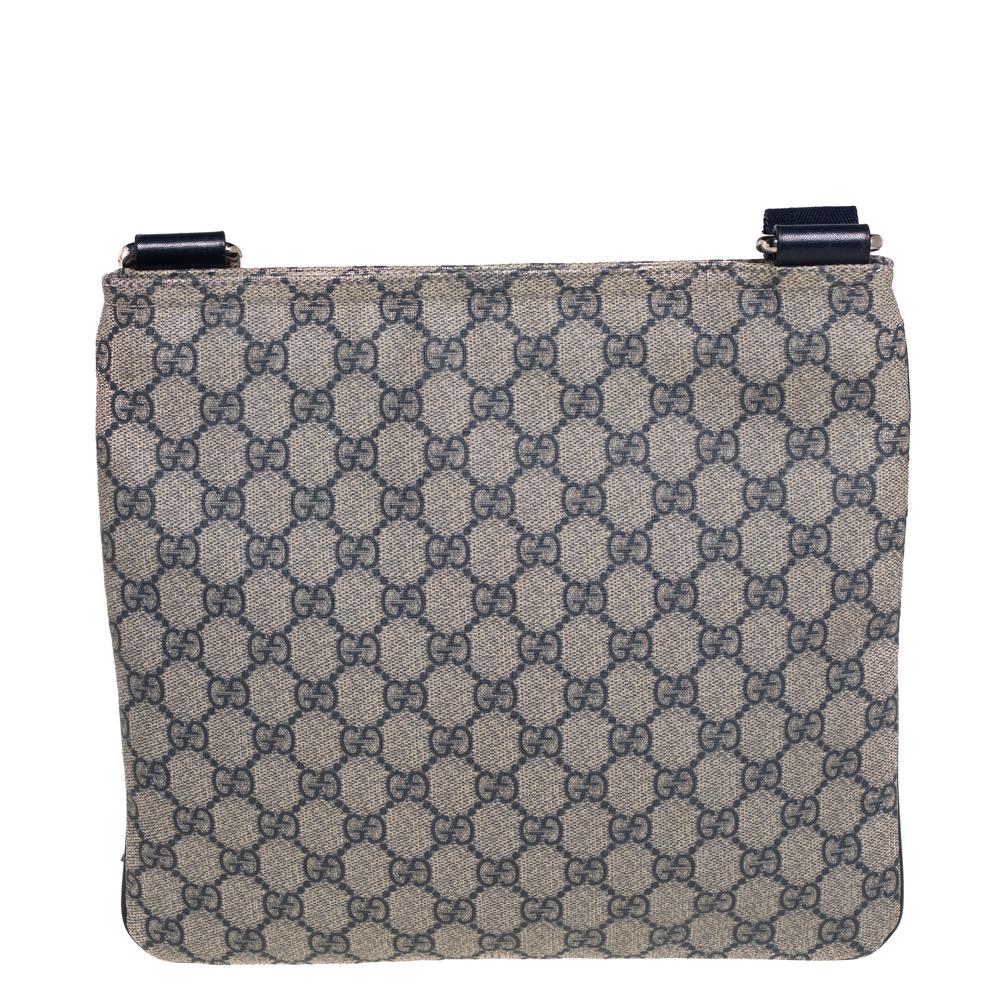 Smart and functional, this messenger bag from Gucci ranks high on style. It has been made from their signature GG Supreme canvas and flaunts a zip pocket on the front. The bag is equipped with a shoulder strap and a spacious canvas-lined interior