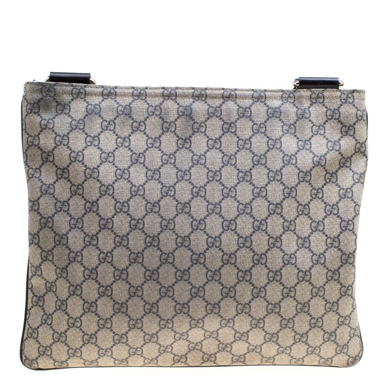 Made from their signature iconic GG coated canvas, this Gucci messenger bag is coupled with blue leather trims, making it super convenient and versatile. It features a single comfortable shoulder strap and a Gucci embossed leather plaque on its