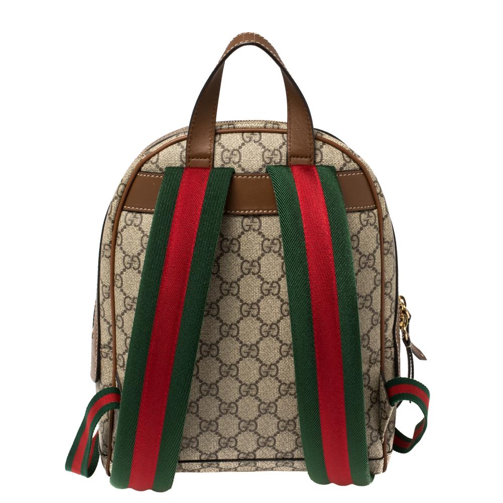 Rendered in GG Supreme canvas and leather, the beige & brown backpack features a bee and floral motifs, signature Web shoulder straps, and an exterior zip pocket. The zip-enclosed spacious interior makes this Gucci bag ideal for travel and daily