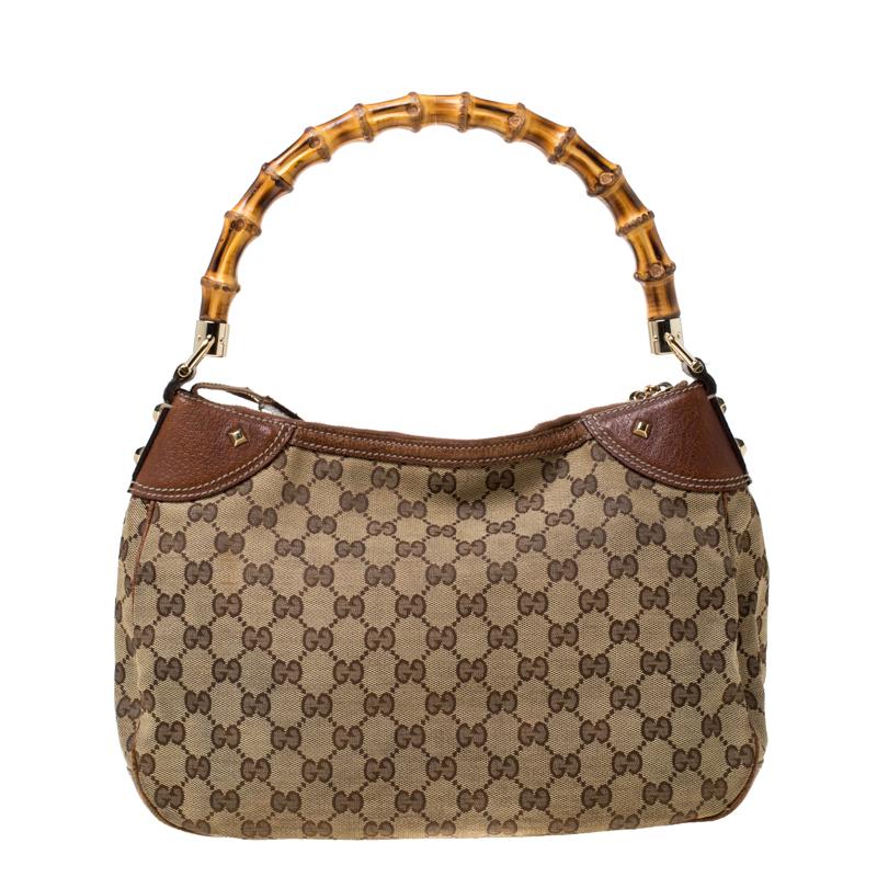 Experience the touch of fine craftsmanship with this immaculately crafted Gucci bag. Made from signature canvas and leather the bag features a zip closure that secures a spacious fabric interior. The bag flaunts a pocket on the front that comes with