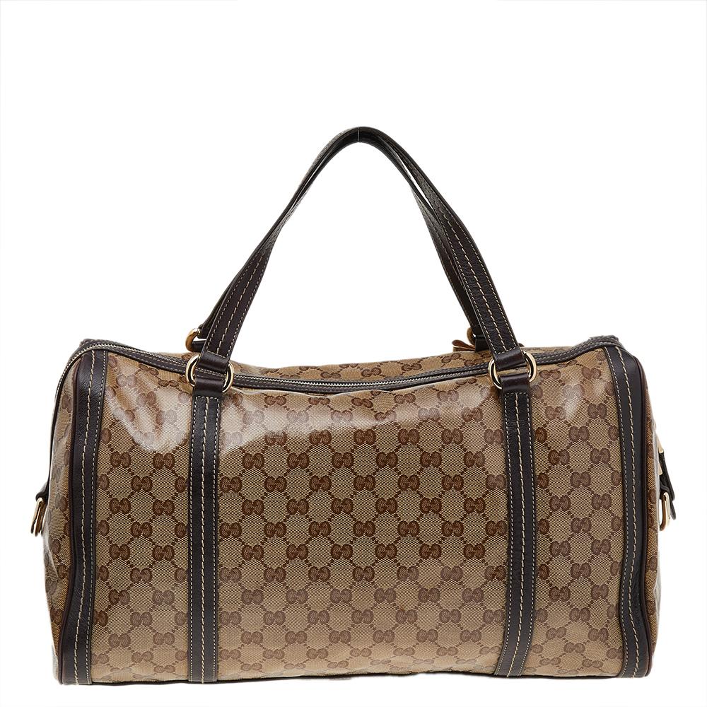 This fashionable and durable Duchessa Boston bag from Gucci will surely meet all your expectations. It is skillfully designed using beige-brown crystal canvas and leather on the exterior, with distinct gold-toned hardware completing its structure.