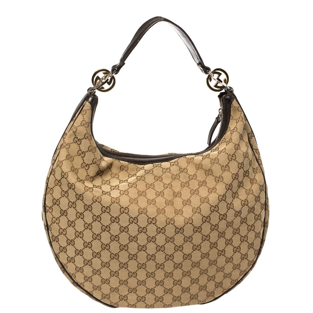 A handbag should be not only good-looking but also durable, just like this pretty Twins hobo from Gucci. Crafted from the signature GG canvas and leather in Italy, this gorgeous number has a top zip closure that opens up to a spacious fabric