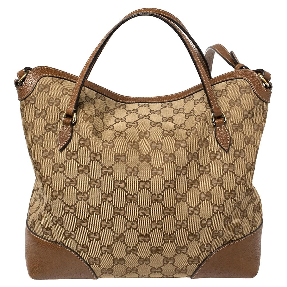 When practicality meets style, you know it is the work of Gucci. Crafted from signature beige GG canvas and leather, this brown Bree tote features two top handles. Secured with a zip fastening, the canvas-lined interior houses a zip pocket and two