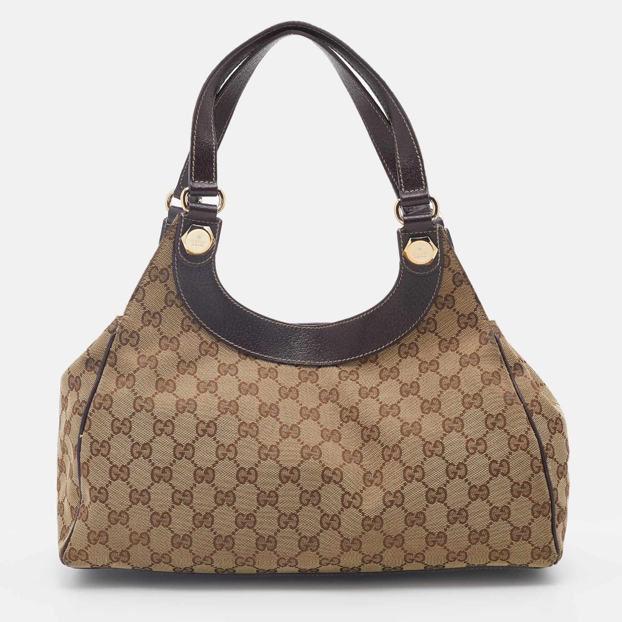 The simple silhouette and the use of GG canvas and leather for the exterior bring out the appeal of this authentic Gucci bag. It features dual flat handles, gold-tone hardware, and a fabric-lined interior.

Includes: Info Booklet, Original Dustbag
 