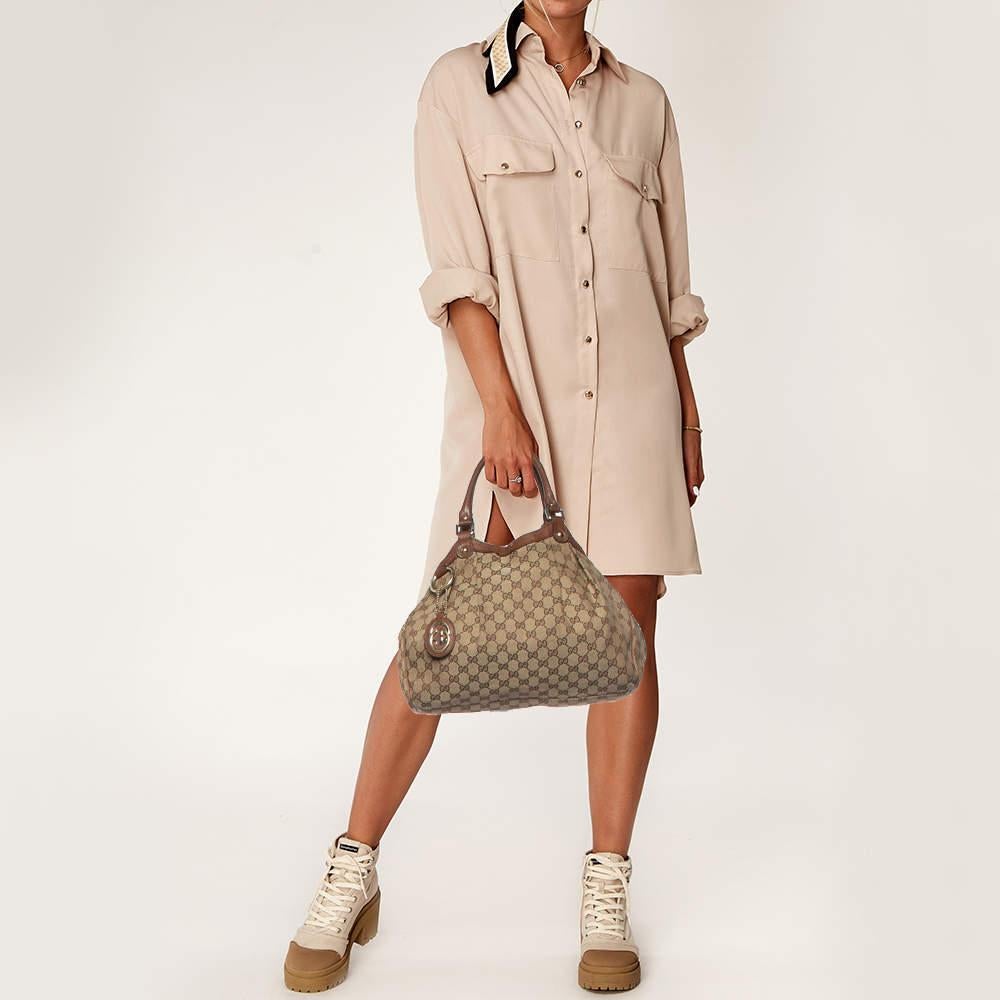 The Sukey is one of the best selling designs from Gucci and we believe you deserve to have one too. Crafted from GG canvas and leather and equipped with a spacious interior this bag will work perfectly with any outfit. It is complete with two