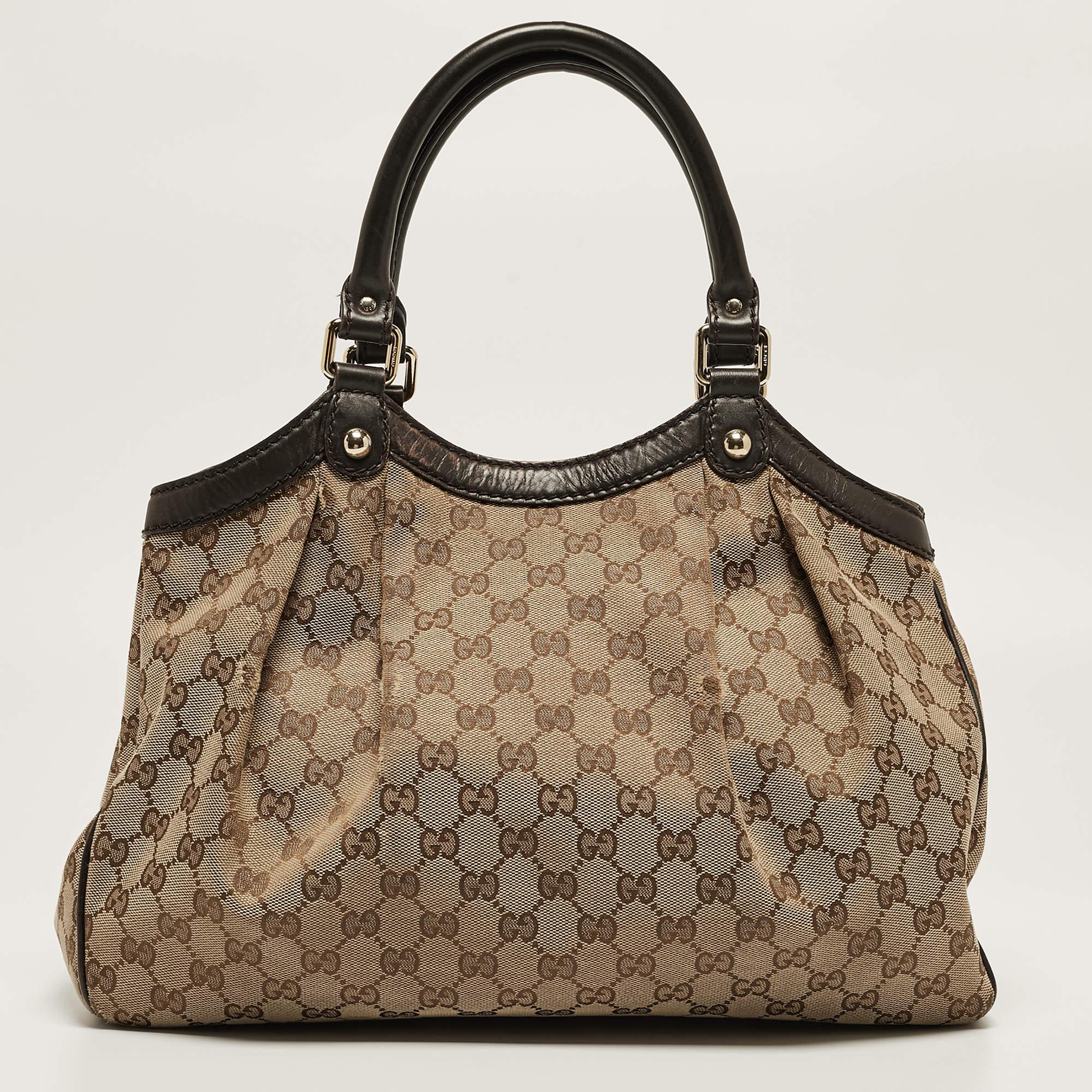 The Sukey is one of the best-selling designs from Gucci, and we believe you deserve to have one too. Crafted from GG canvas & leather and equipped with a spacious interior, this bag will work perfectly with any outfit. It is complete with two