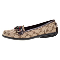 Mocasines Gucci beige/marrón GG de lona y piel con detalle de lazo en la web Talla 35.5