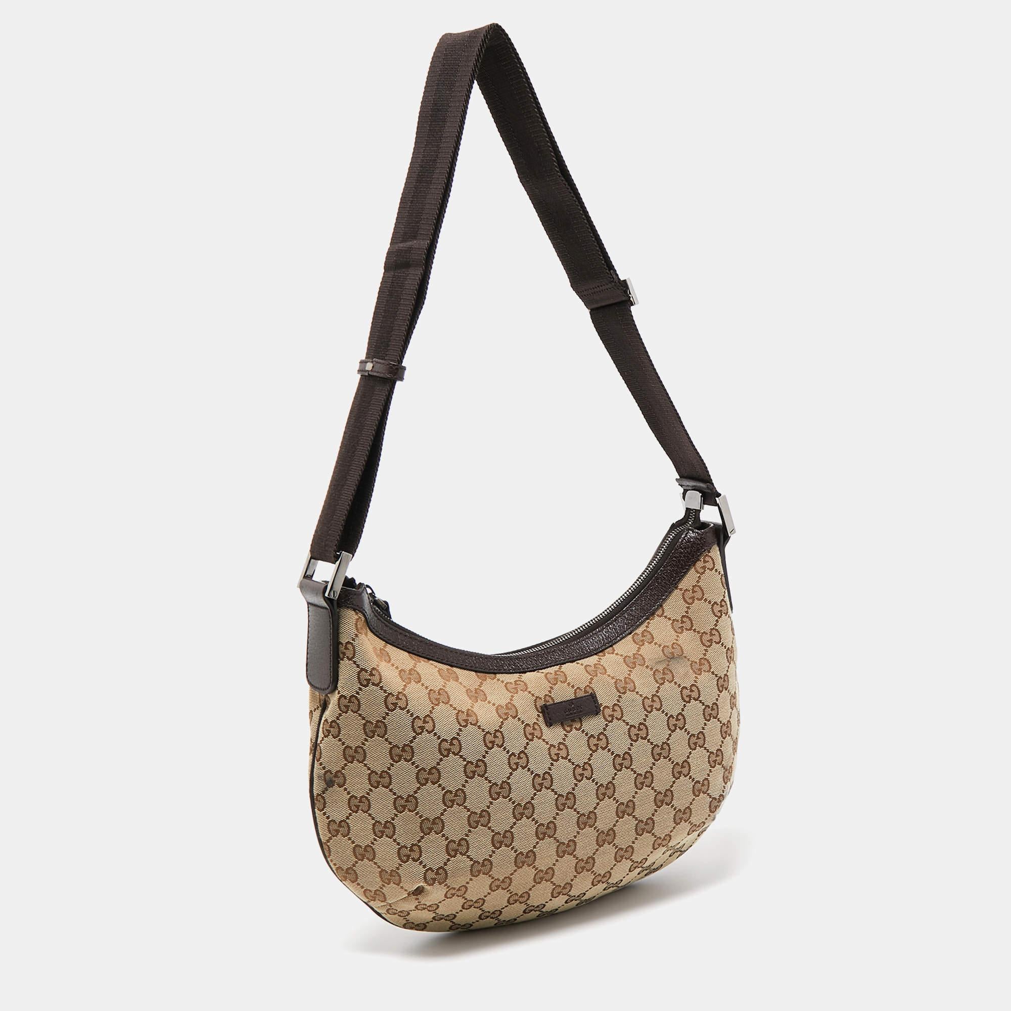 Indulge in timeless luxury with this Gucci GG canvas bag for women. Meticulously crafted, this exquisite accessory embodies elegance, functionality, and style, making it the ultimate companion for every sophisticated woman.

