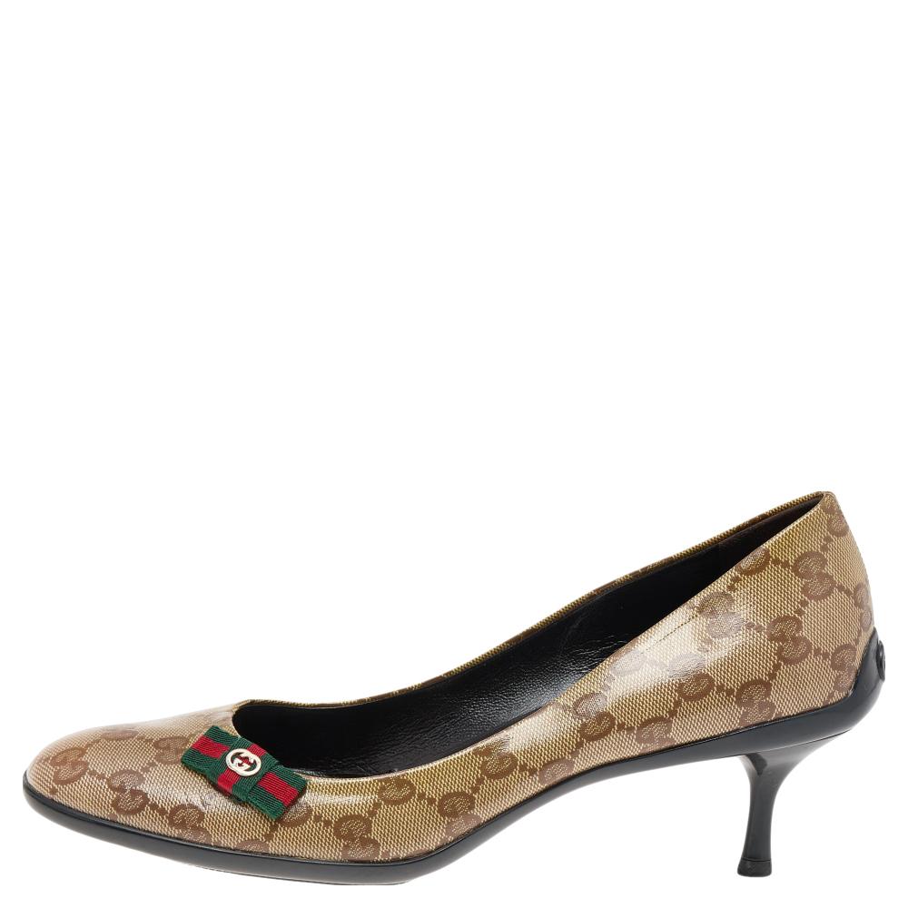This stunning pair of pumps from Gucci are sure to make you feel sophisticated yet chic. These pumps have a GG canvas exterior with little Web bows and leather insoles, giving a modern touch.