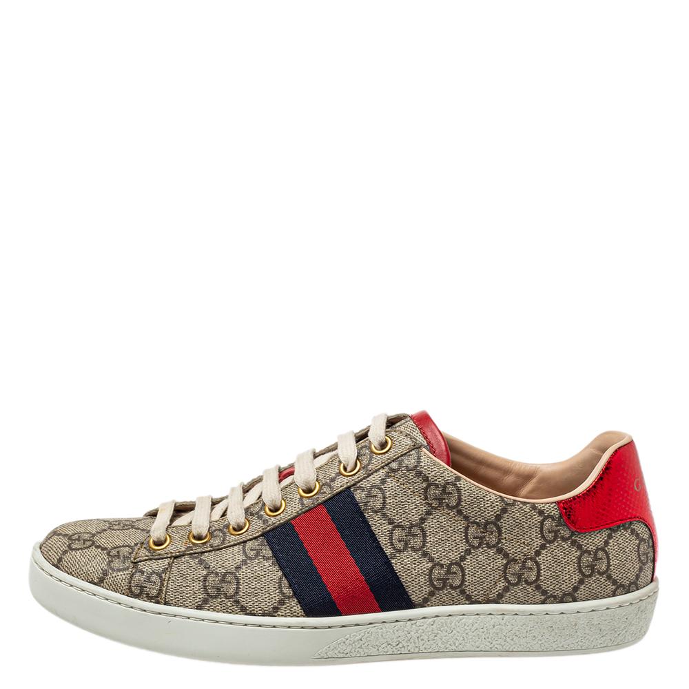 Stacked with signature details, this Gucci pair is rendered in GG coated canvas and is designed in a low-cut style with lace-up vamps. They have been fashioned with the iconic web stripes. Complete with red and blue embossed trims carrying the brand