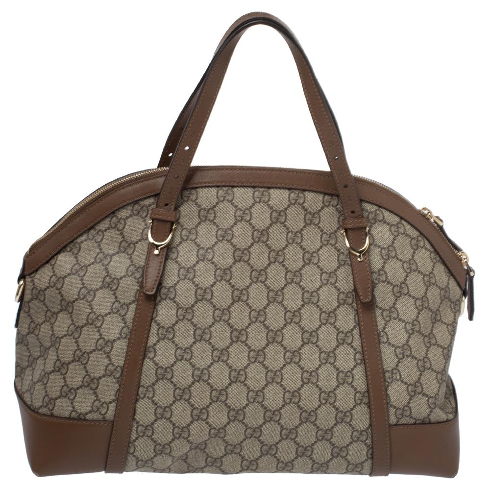 Creations from Gucci are loved for their excellent designs and craftsmanship. This Nice Dome bag proves just that! It comes crafted from the signature GG Supreme canvas and leather and features dual top handles and a top zip closure that opens to a