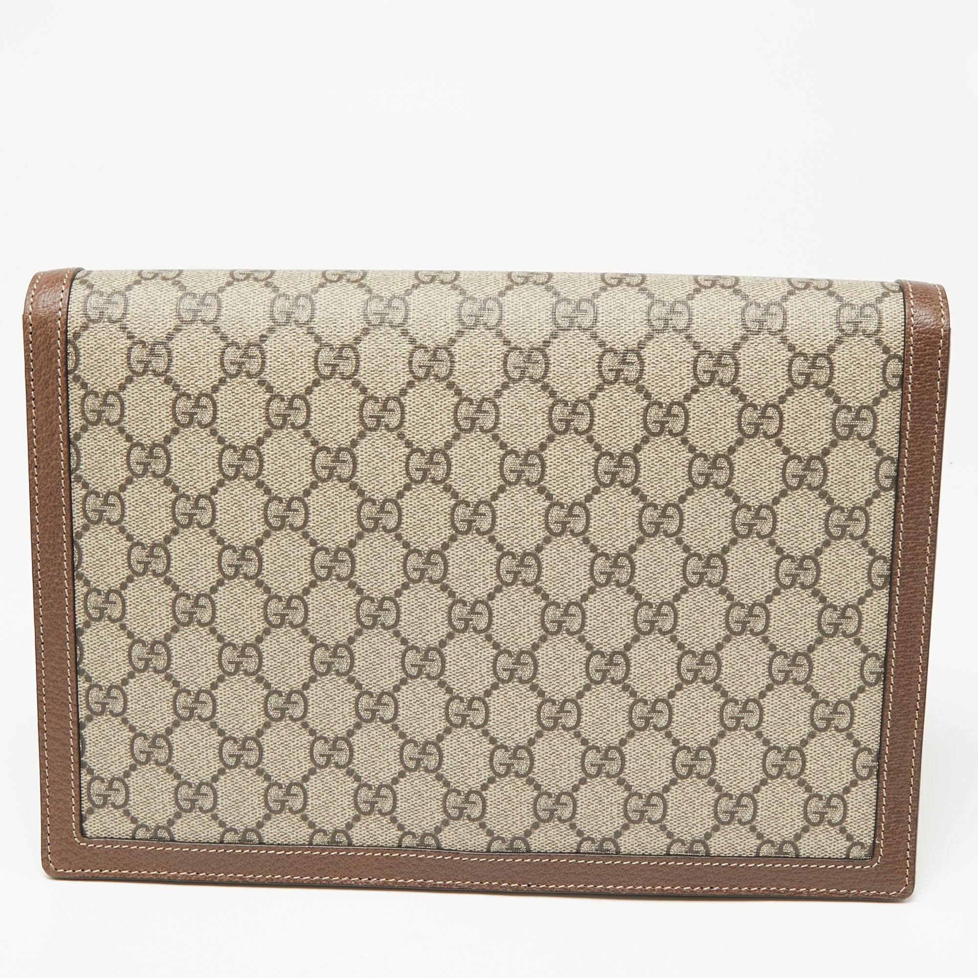 This fashionable pouch by Gucci is easy to carry and is a fusion of trend and functionality. An excellent complement to your charm is this pouch in shades of beige and brown. The plush texture of the coated canvas and leather used for this piece